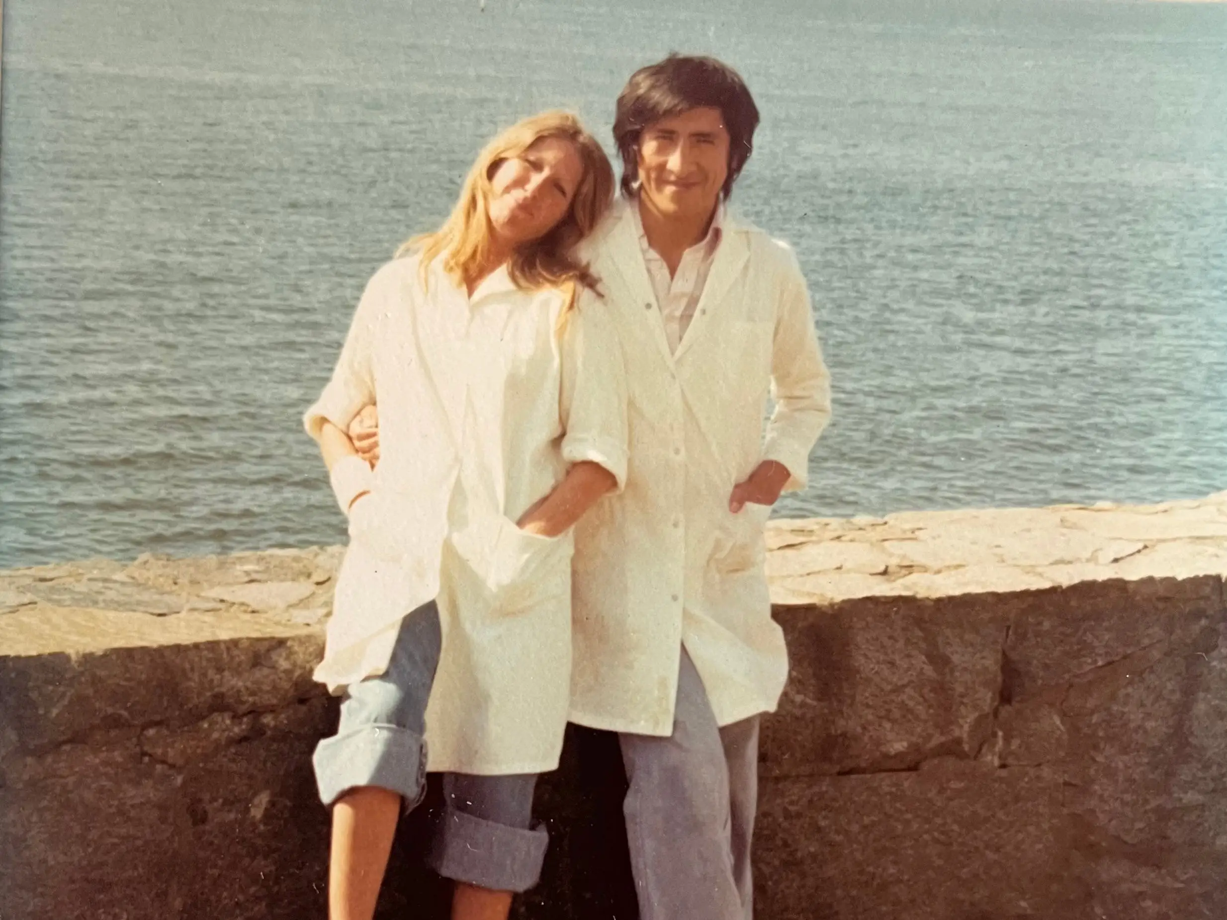 Old photo of couple by the ocean