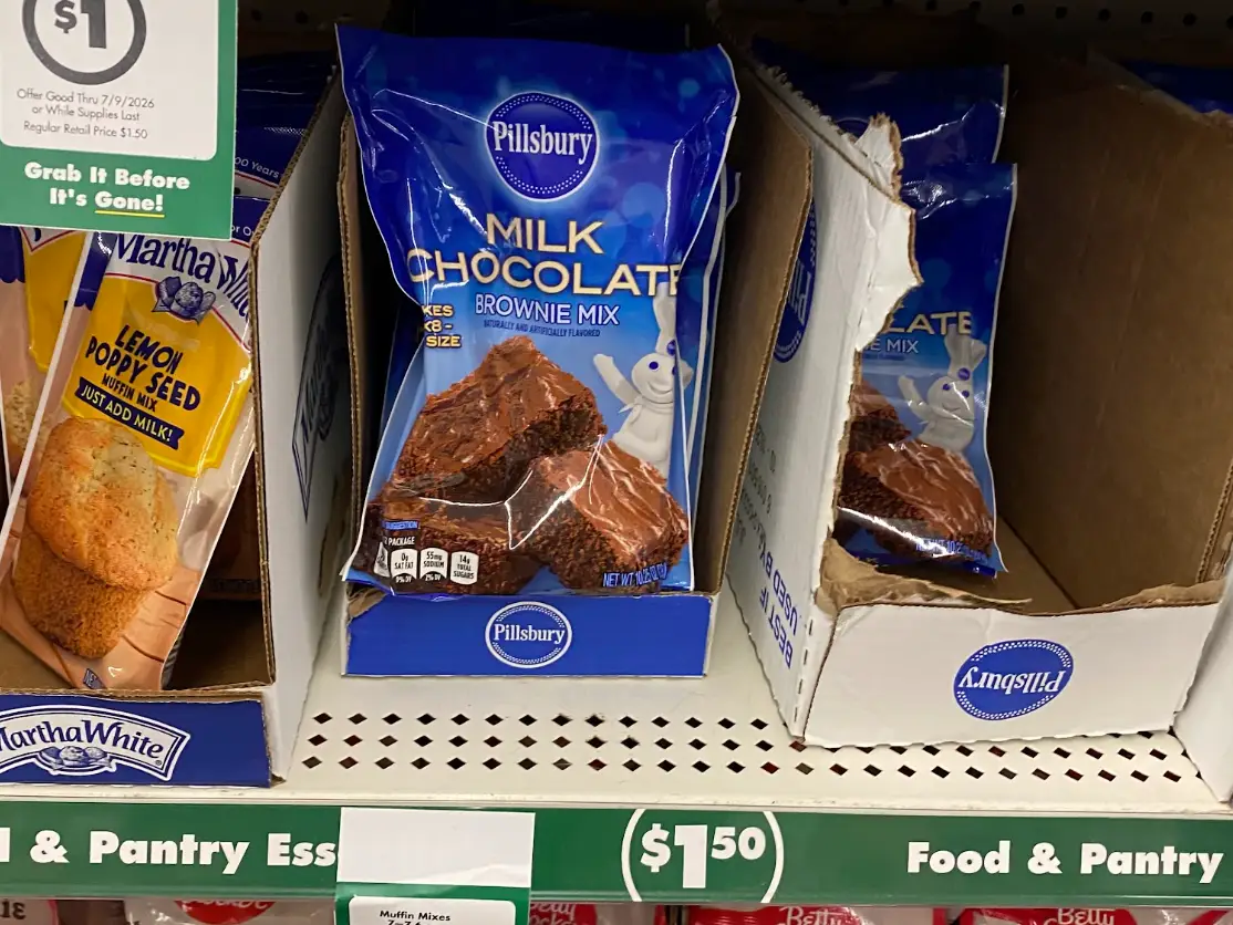 Shelves of brownie and cookie mixes at Dollar Tree.
