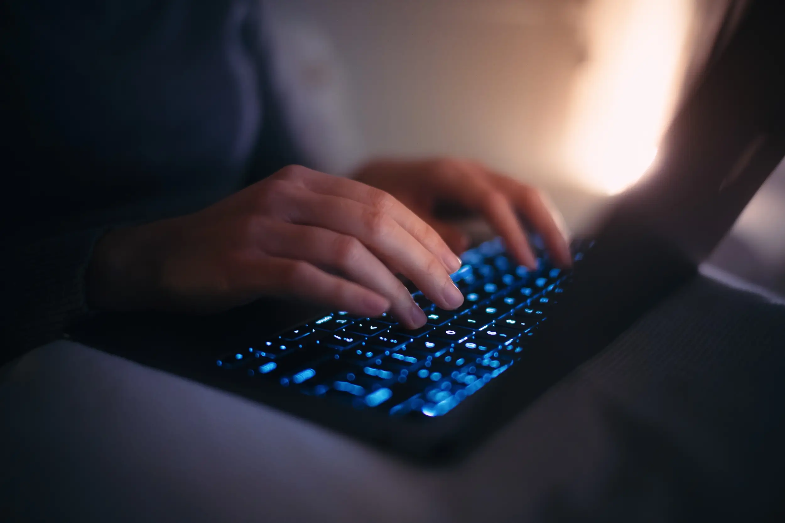A stock image of hands typing at a keyboard