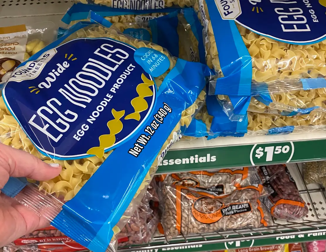 A pack of Founders Street wide egg noodles in a Dollar Tree aisle.