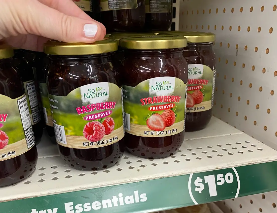 Jars of So Natural raspberry and strawberry preserves.