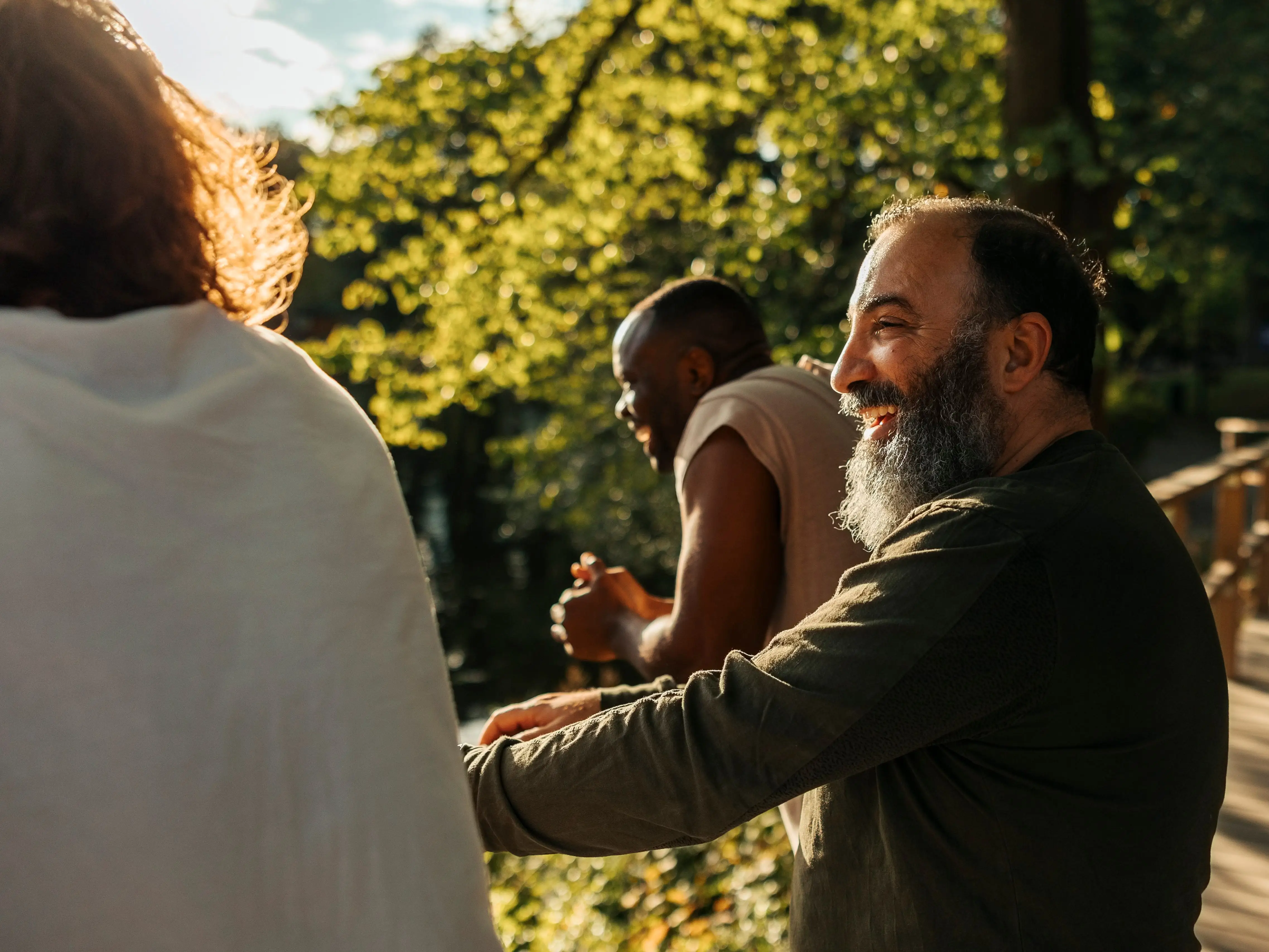 A man smiling with friends