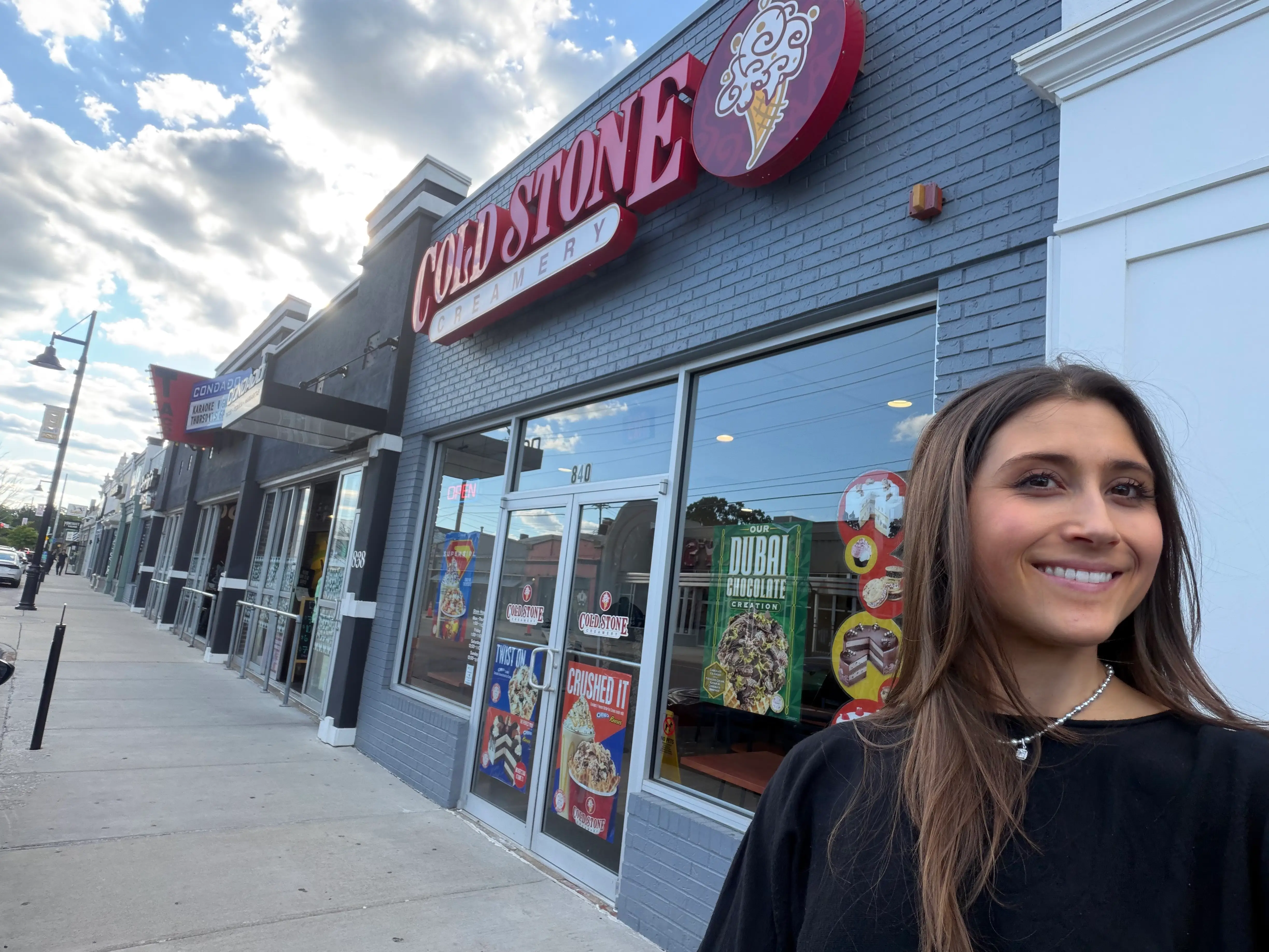 Woman smiling outside of Cold Stone Creamery