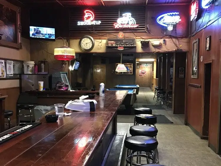 Empty barstools next to counter