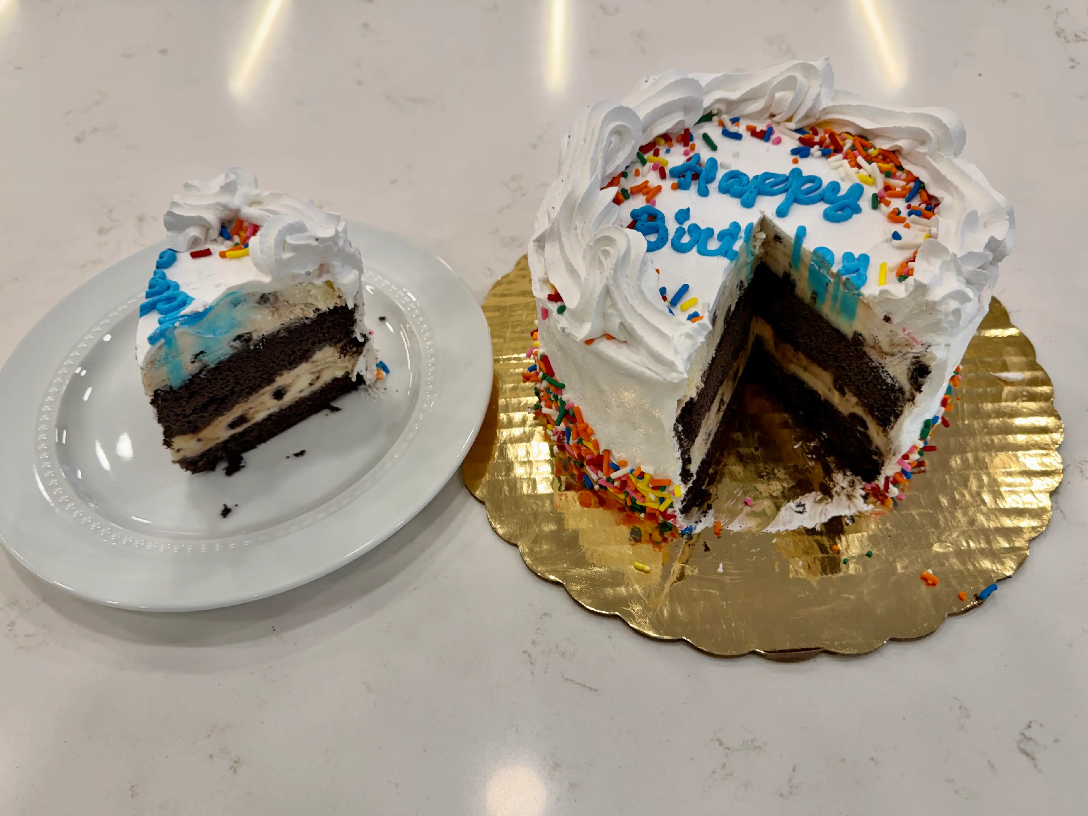 Ice cream cake from cold stone reamery with slice taken out of it