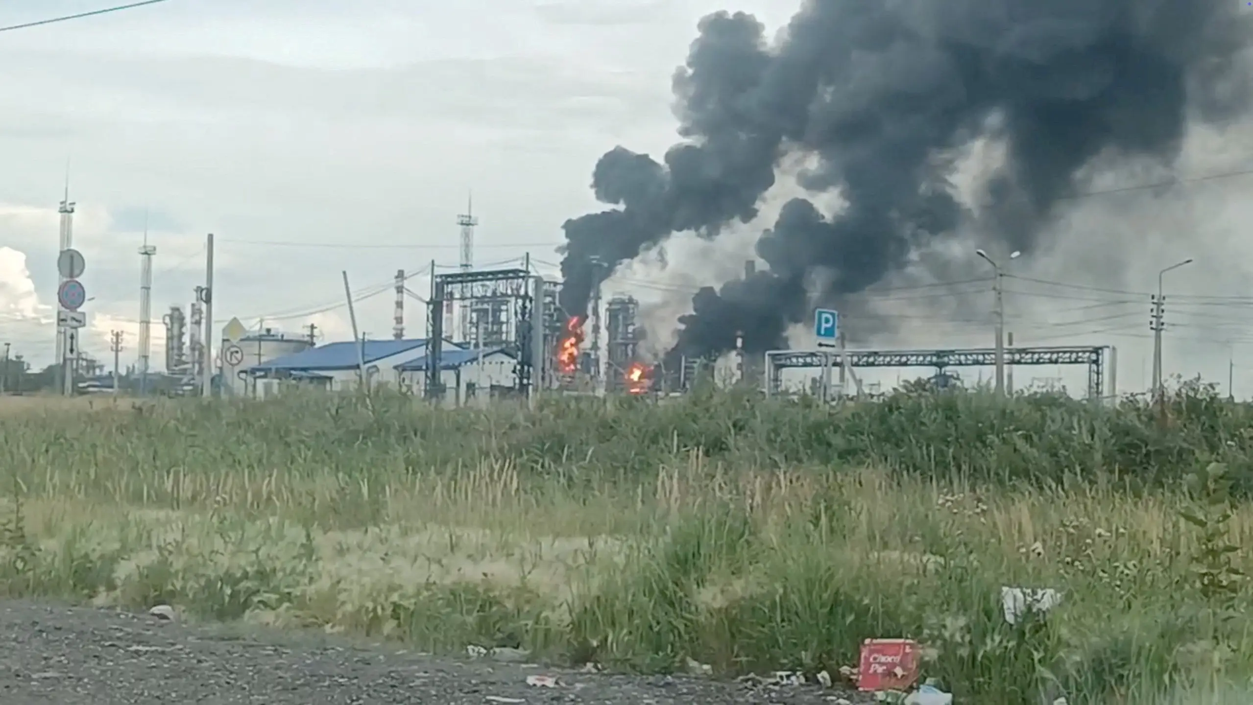 Smoke rises from the Omsk refinery.