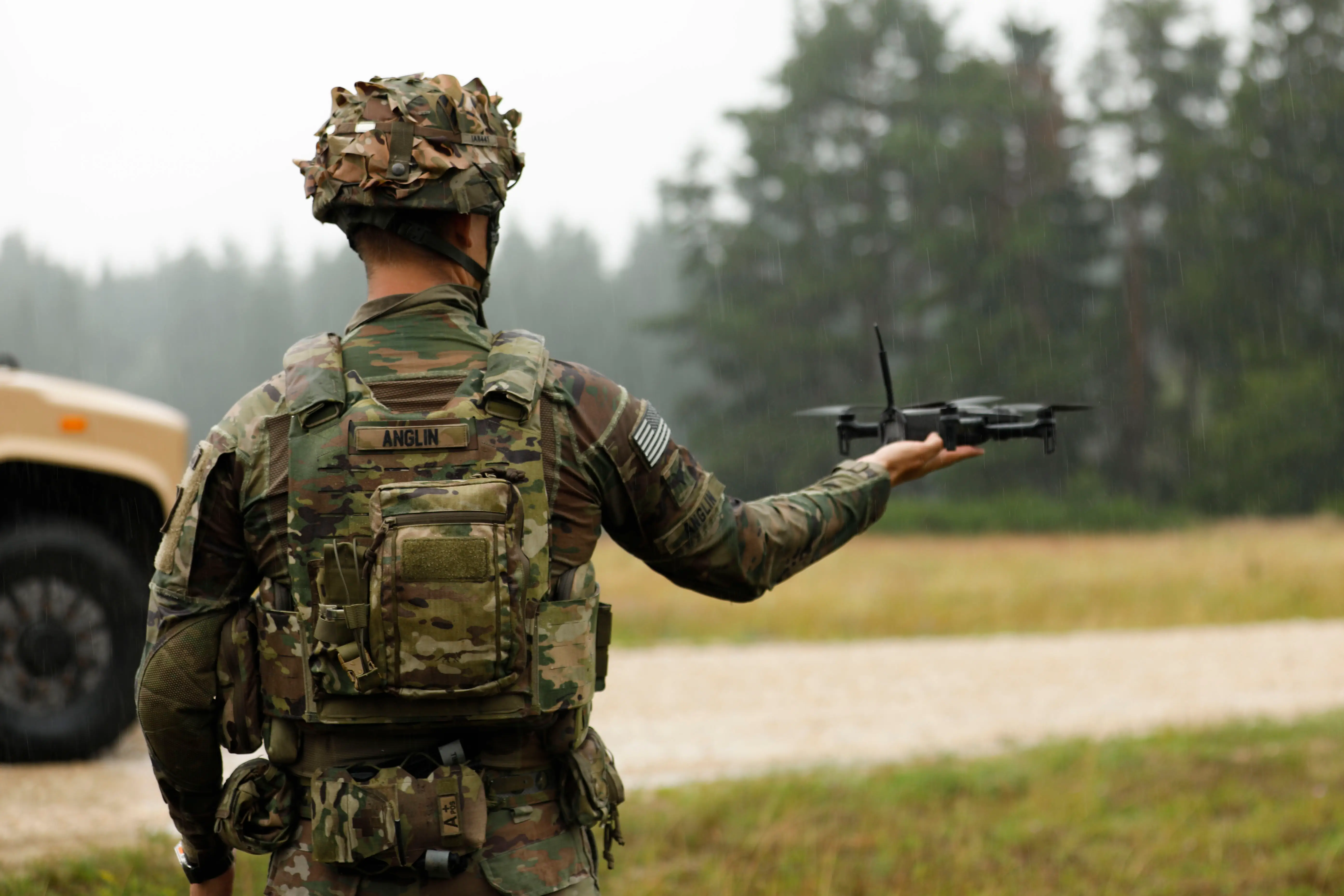 US Army Spc. Ian Anglin, assigned to the Deathwatch Platoon, 10th Brigade Engineer Battalion, 1st Armored Brigade Combat Team, 3rd Infantry Division, assisting during a first-person view drone release, on Grafenwöhr Training Area, July 21, 2025.