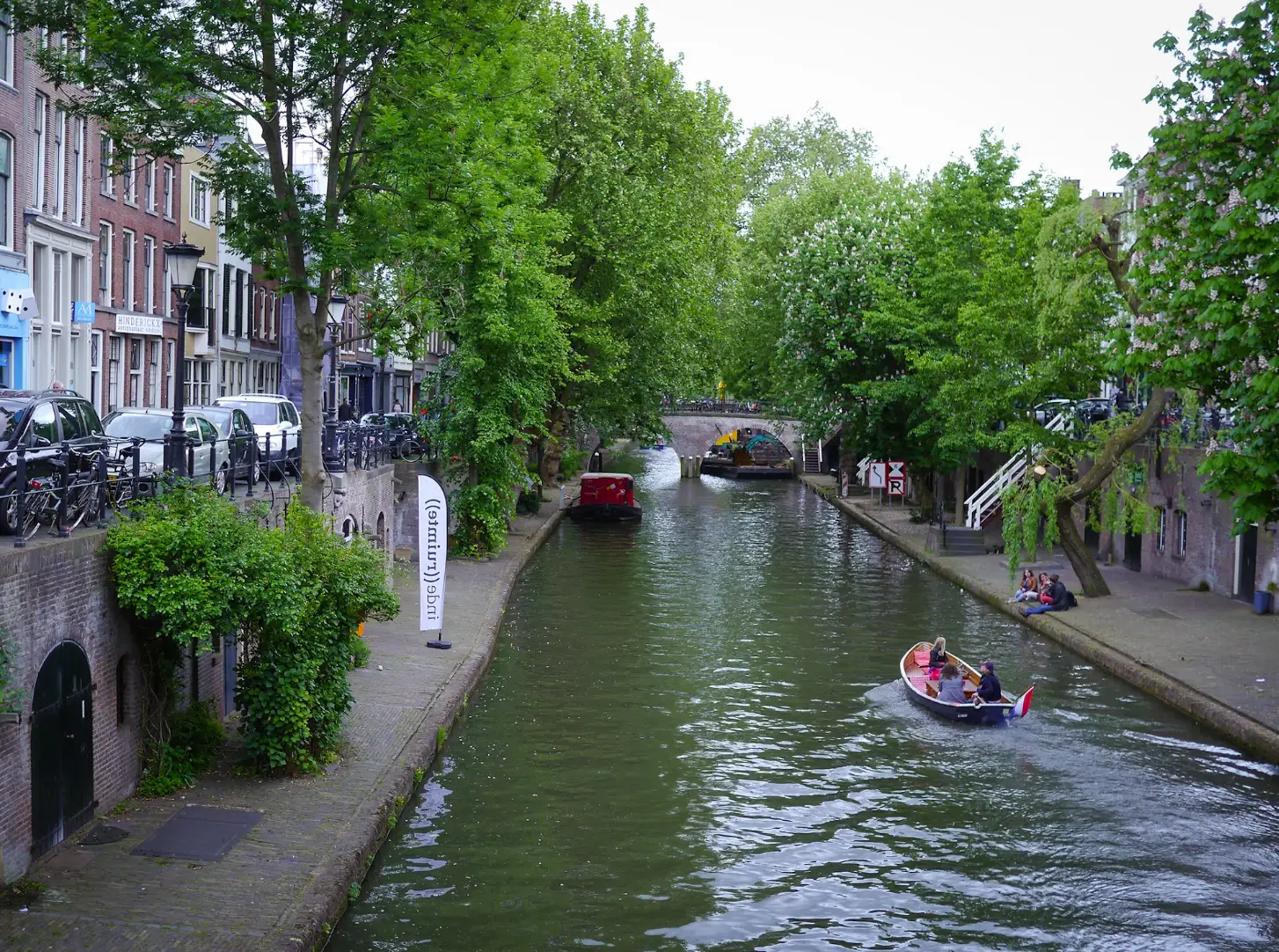 Boats gliding down the canals of Utrecht, the Netherlands.