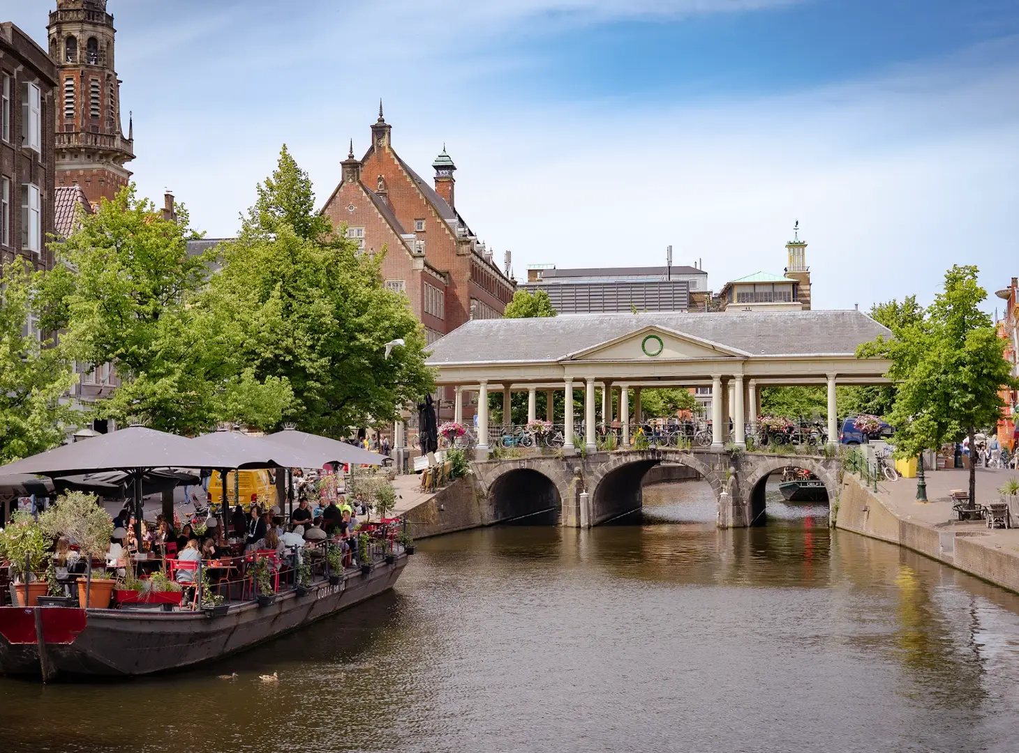 A small bridge and a floating restaurant in Leiden, the Netherlands.