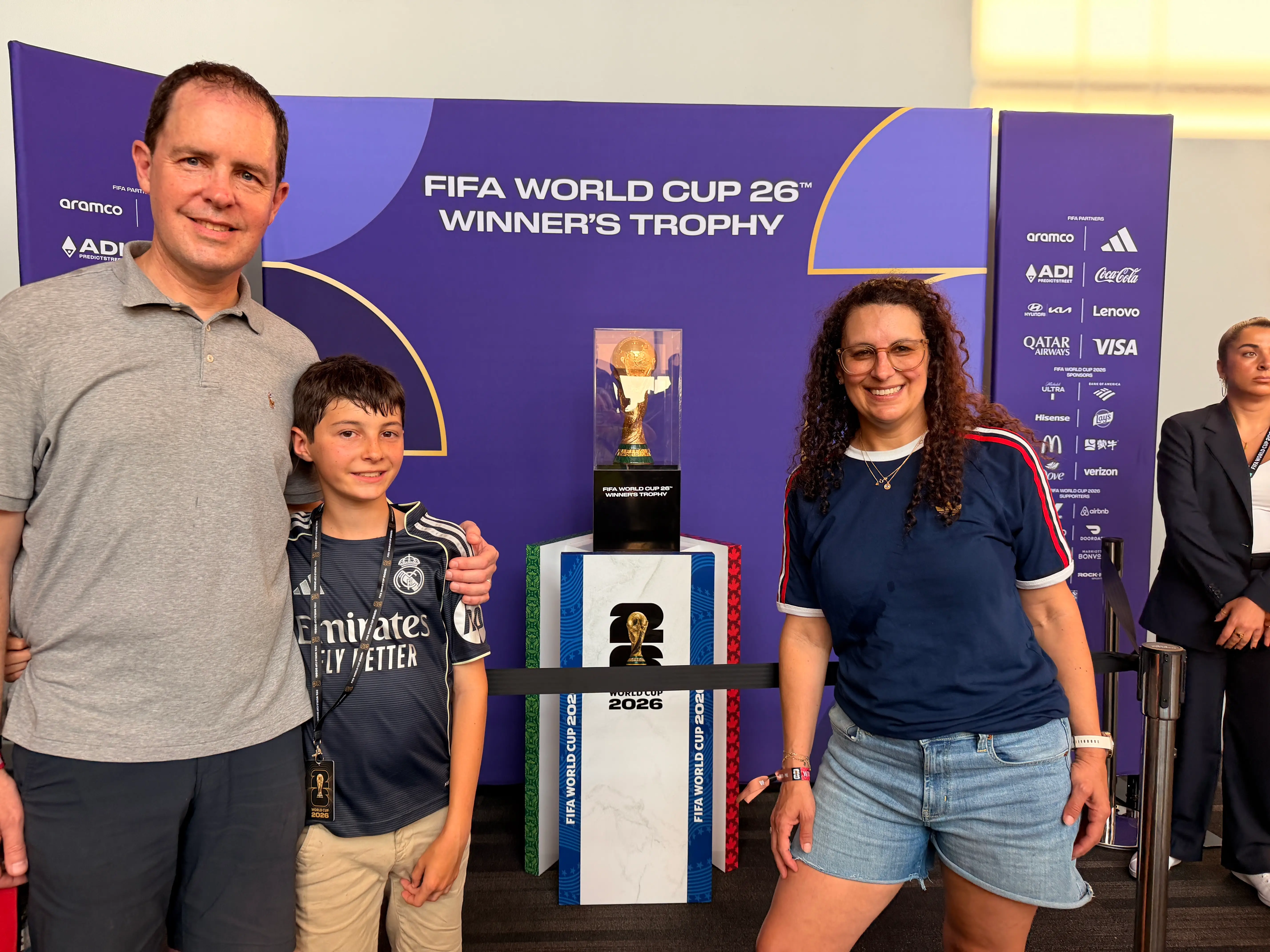 The author (right) with her HUsband and their son at a World Cup game.