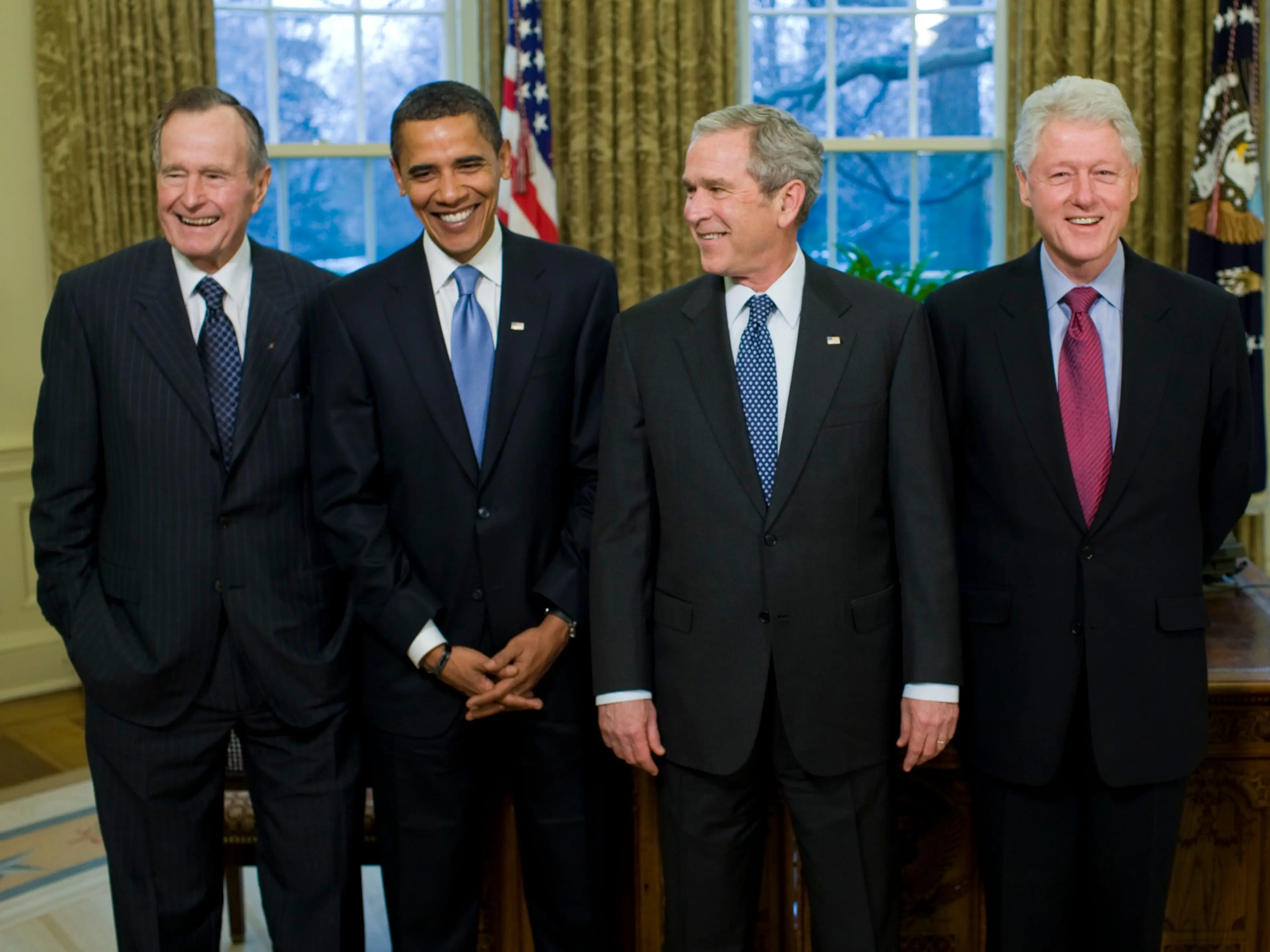 President George W. Bush (C) meets with former President George H.W. Bush (L), President-elect Barack Obama (2nd L), former President Bill Clinton (2nd R) and former President Jimmy Carter (R) in the Oval Office of the White House in Washington DC.
