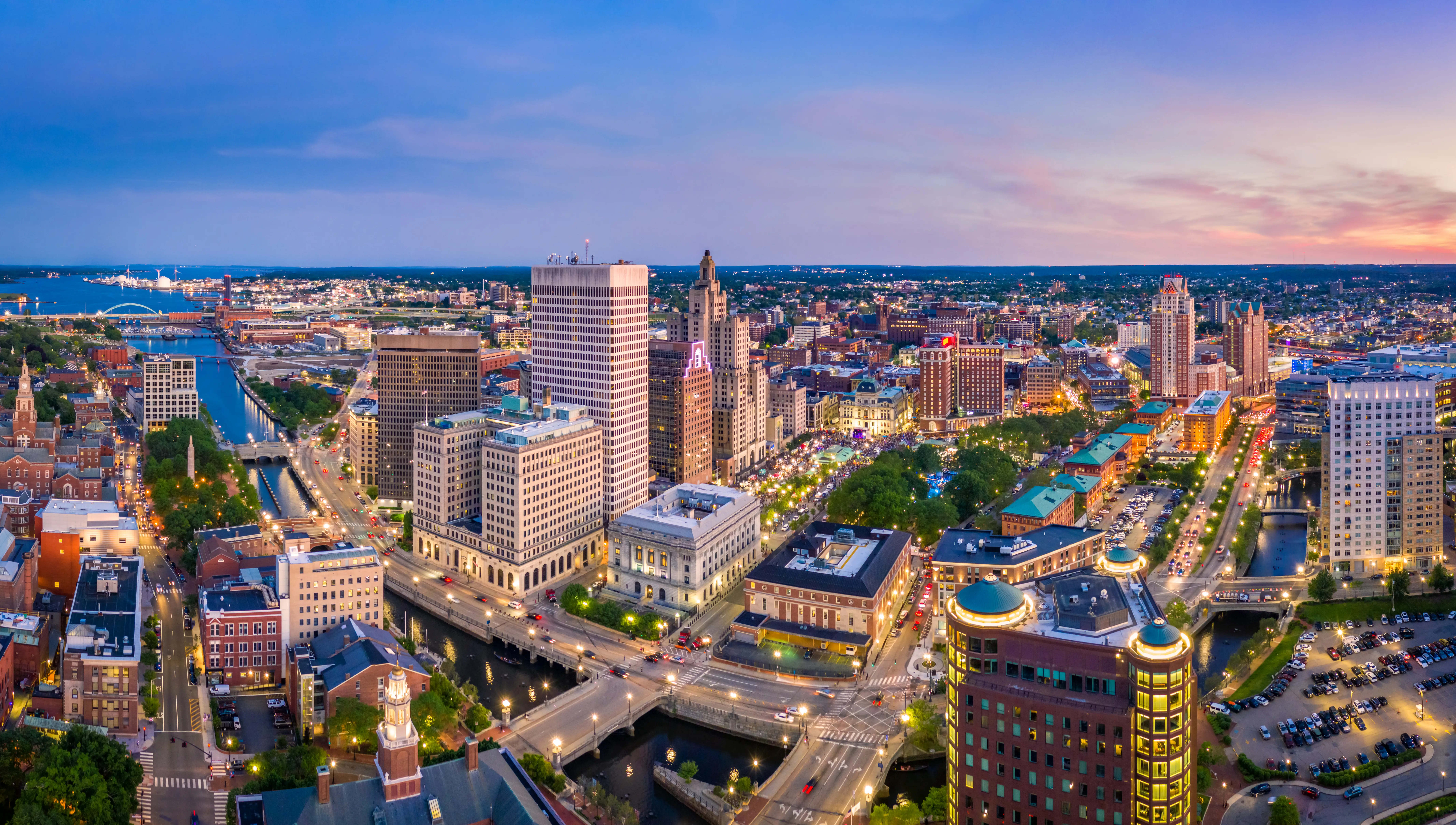 Aerial panorama of the Providence, Rhode Island, skyline at dusk.