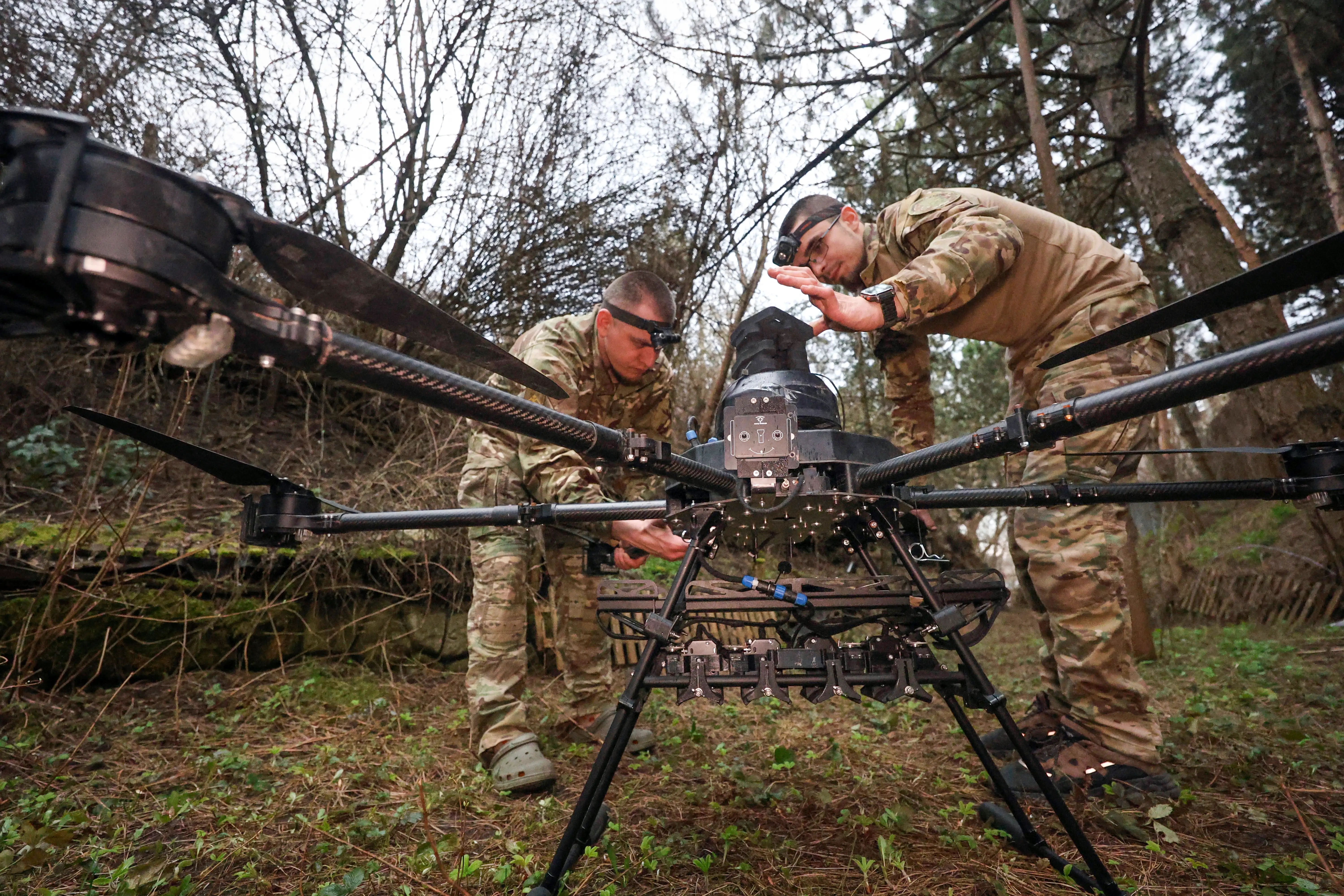 Ukrainain engineers tinker with a Vampire drone.
