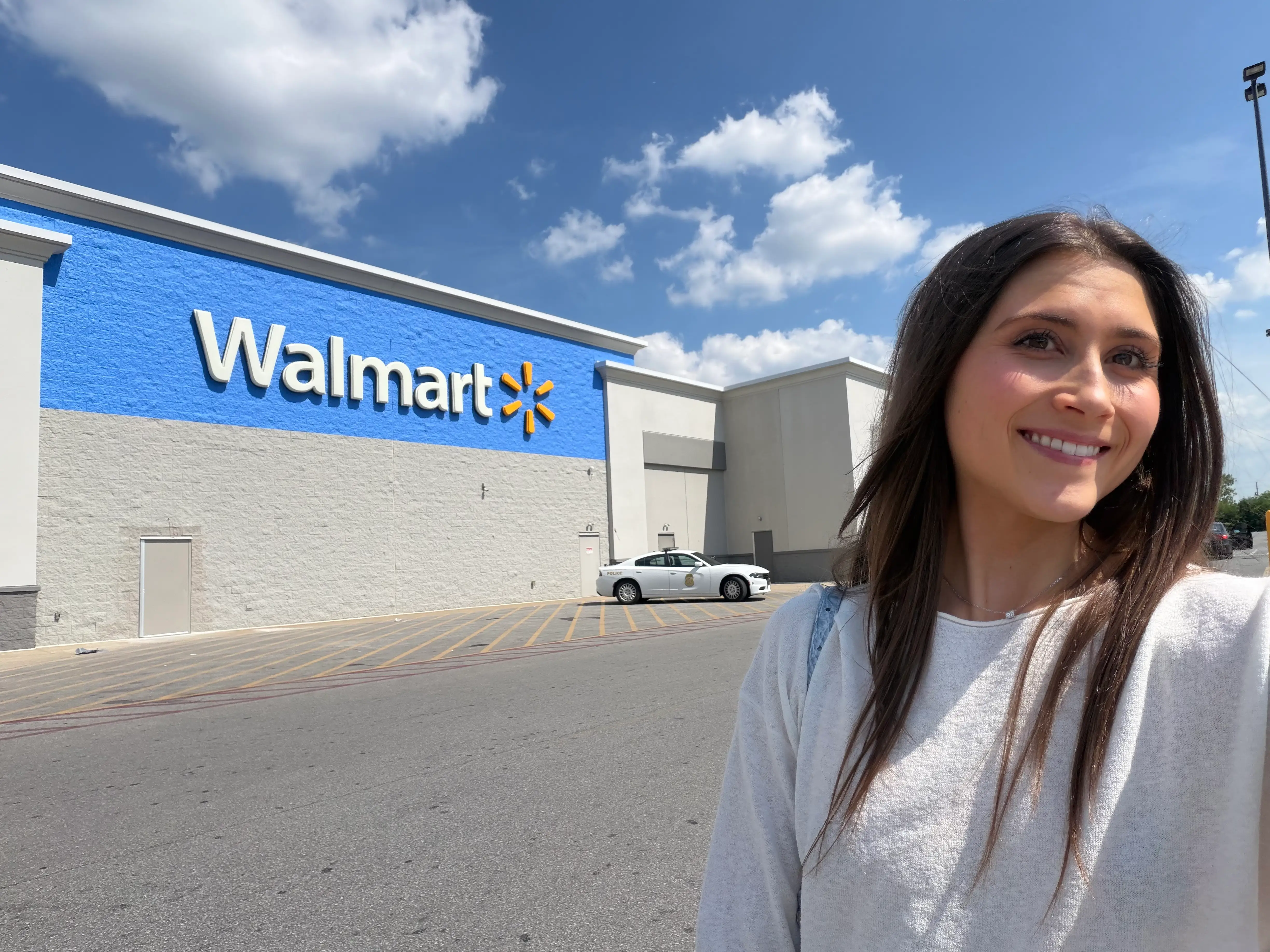 Woman smiling in front of Walmart