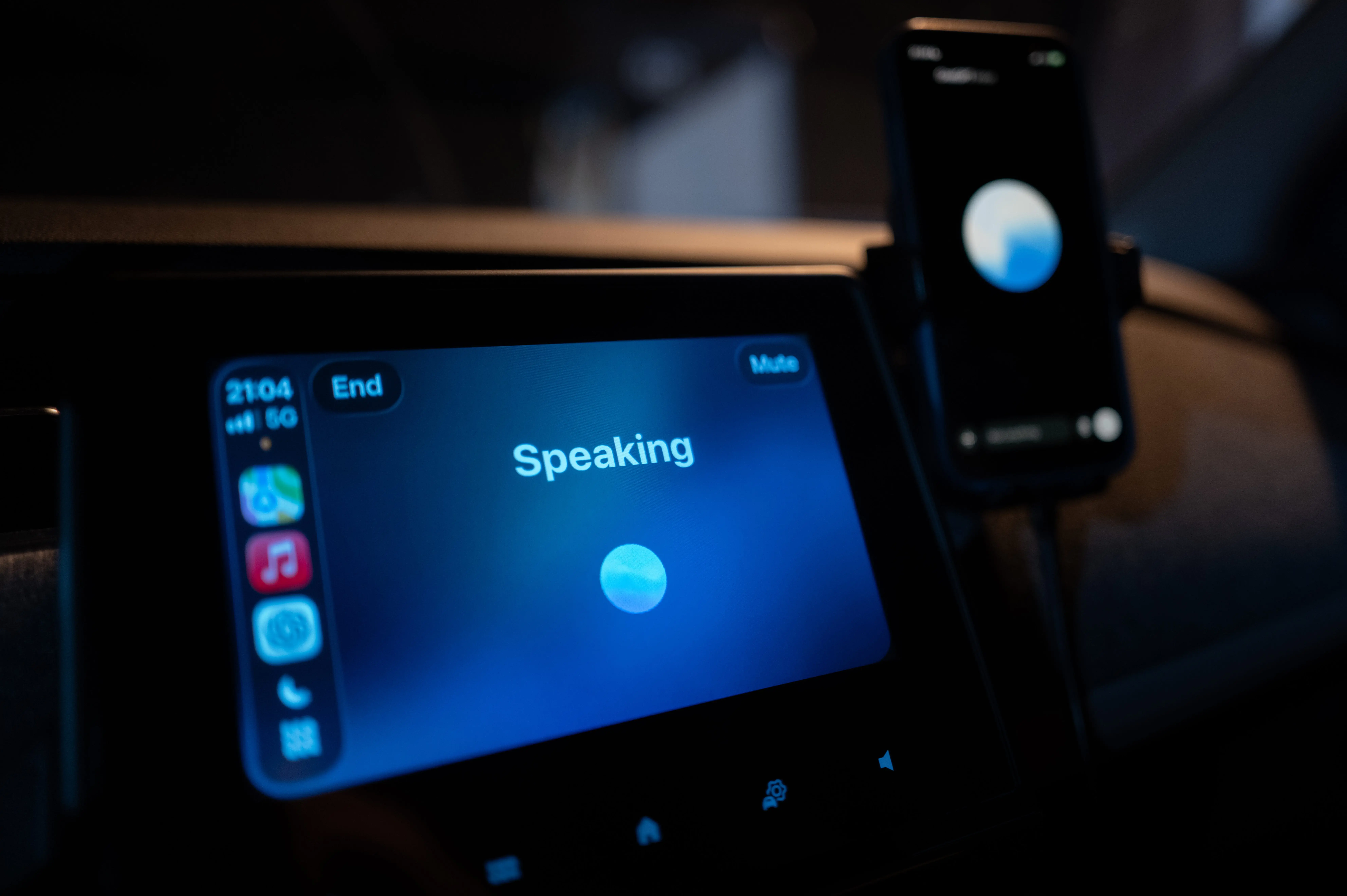 A car's infotainment screen shows OpenAI's chatbot talking to an occupant.
