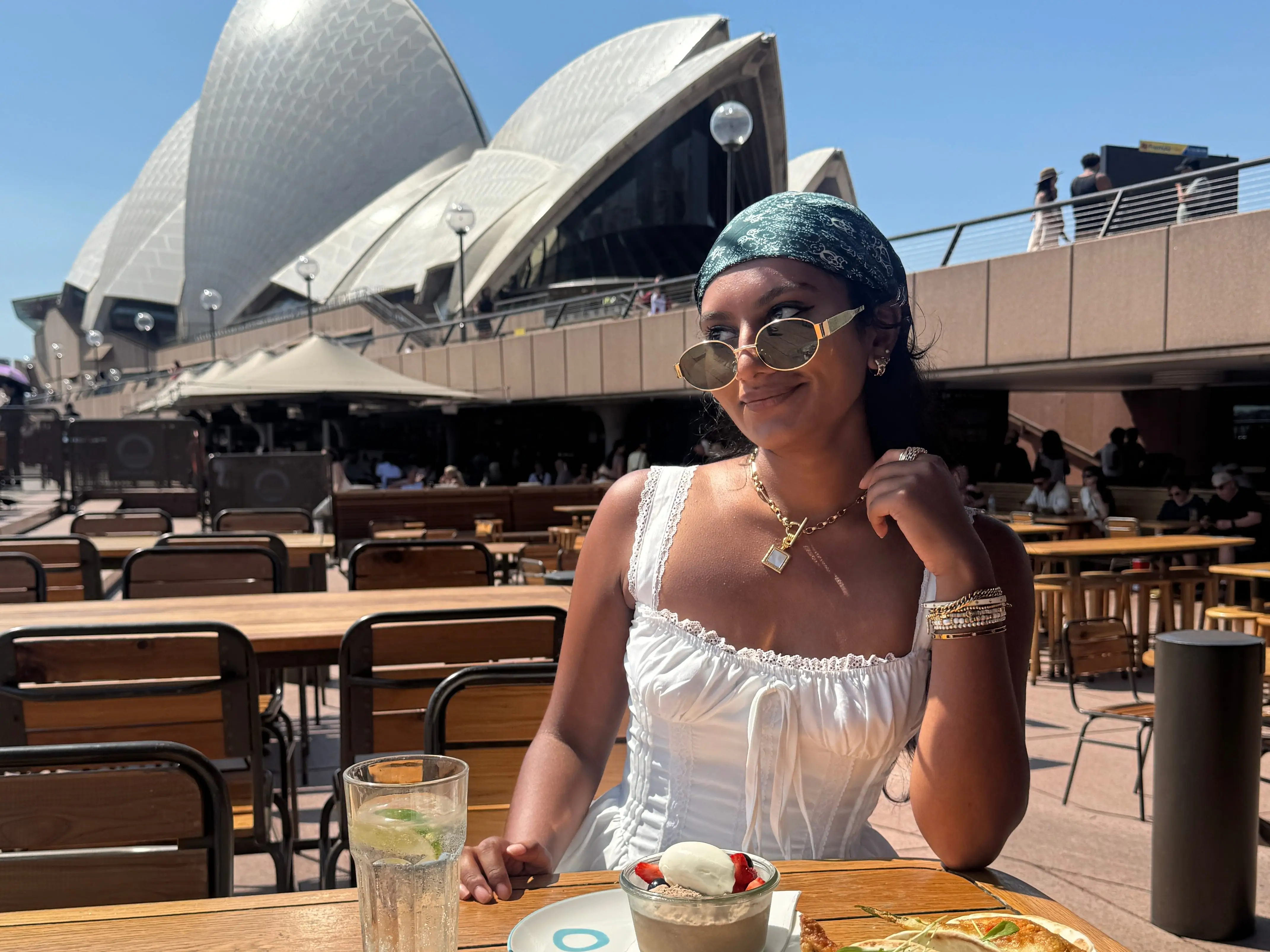 The writer eating food near the Sydney Opera House in Australia.