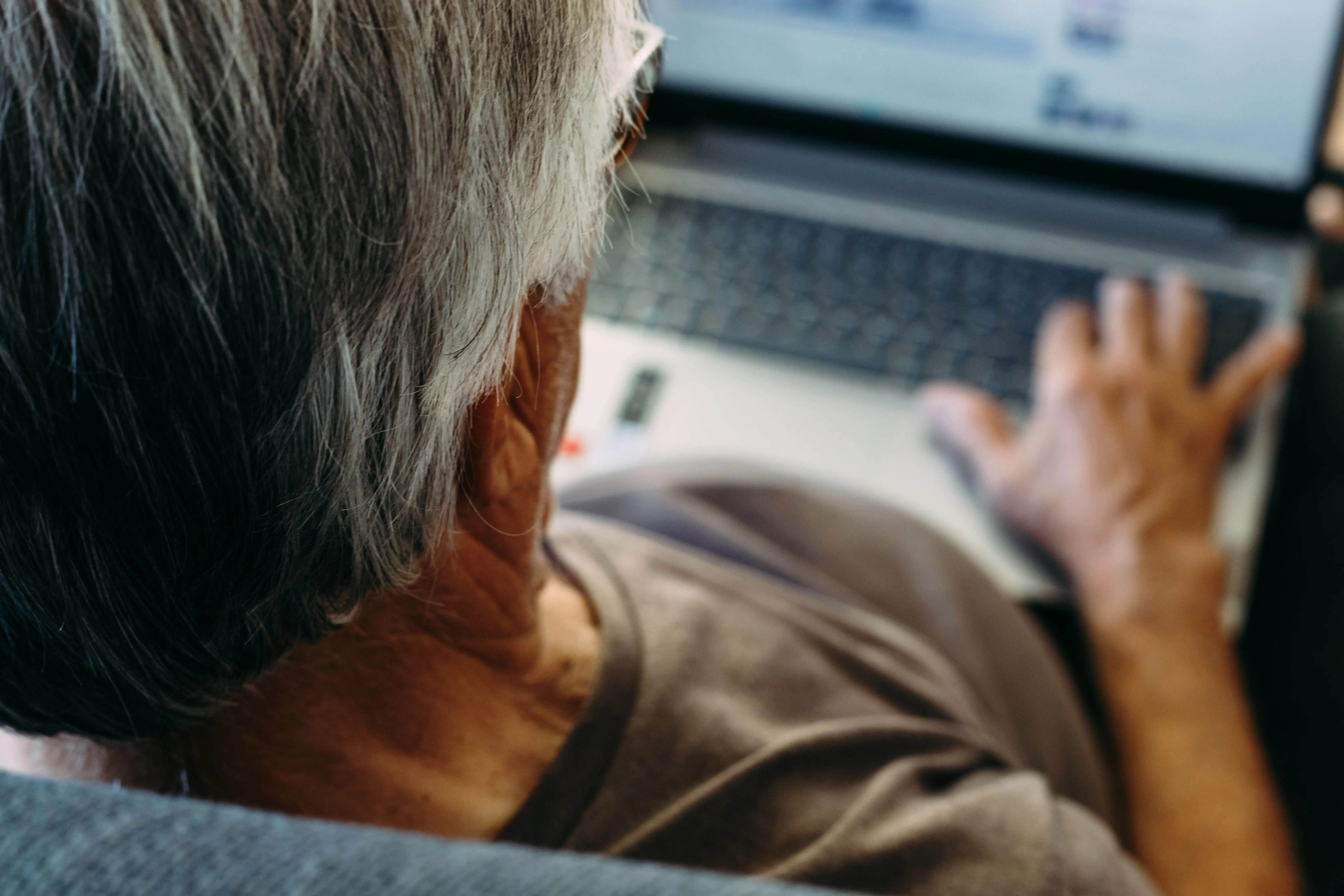 Senior man using laptop