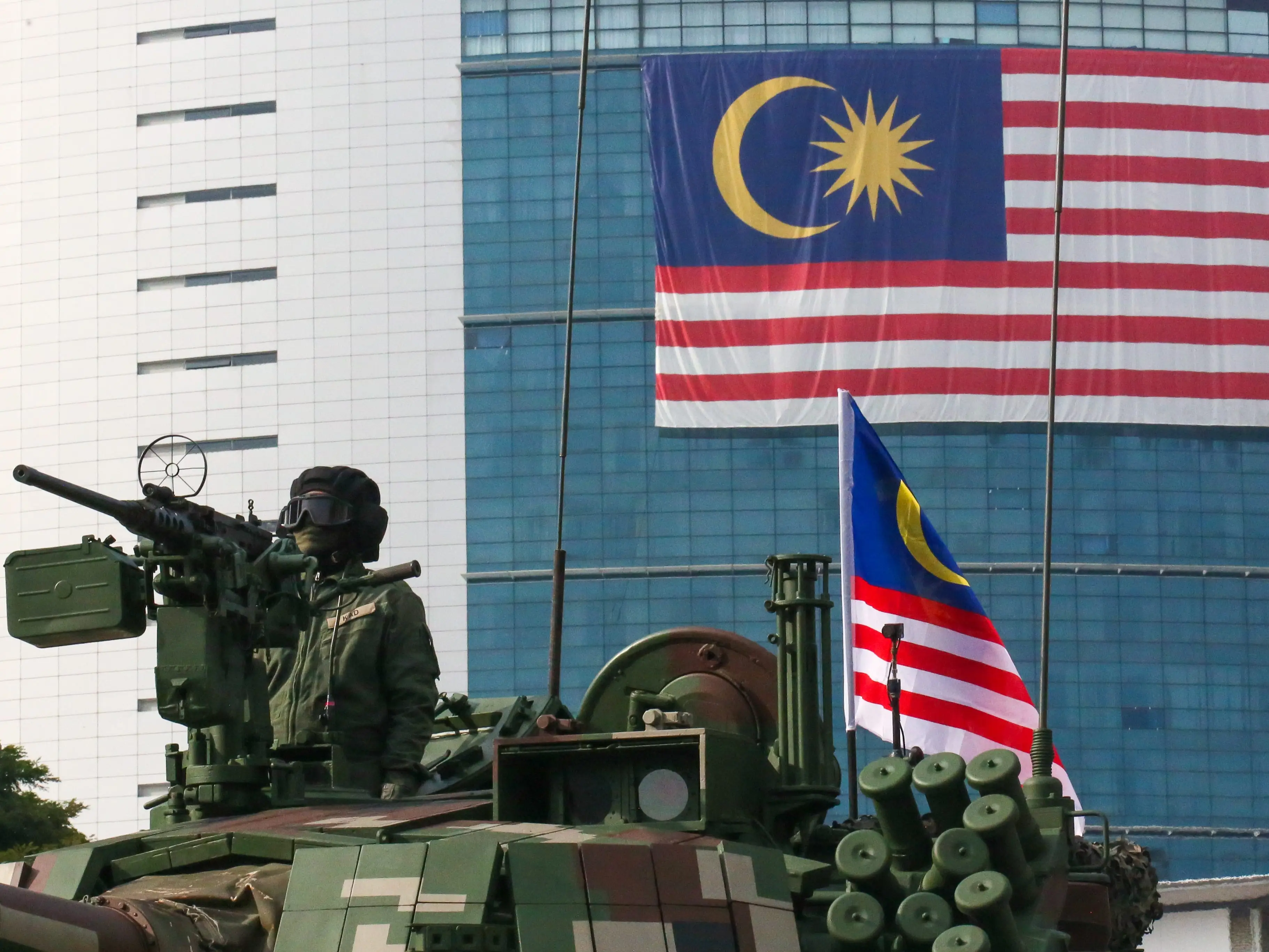 Malaysian Military Armored contingent parades in a tank during the 68th Malaysia Independence day celebration.