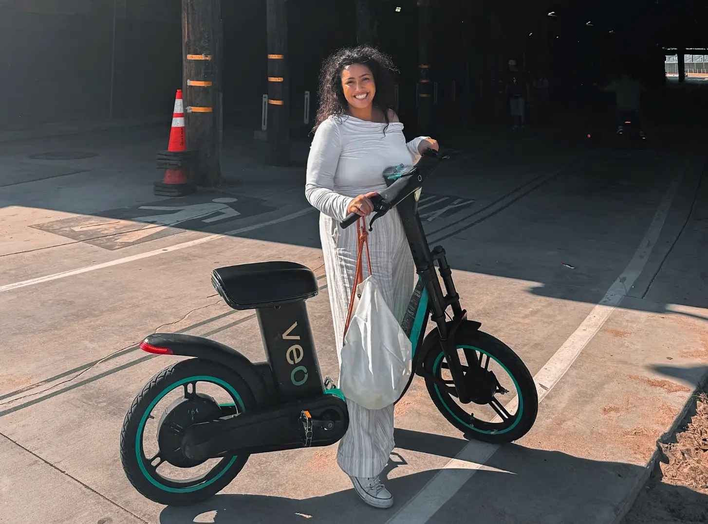The writer standing with a bike in Venice Beach.