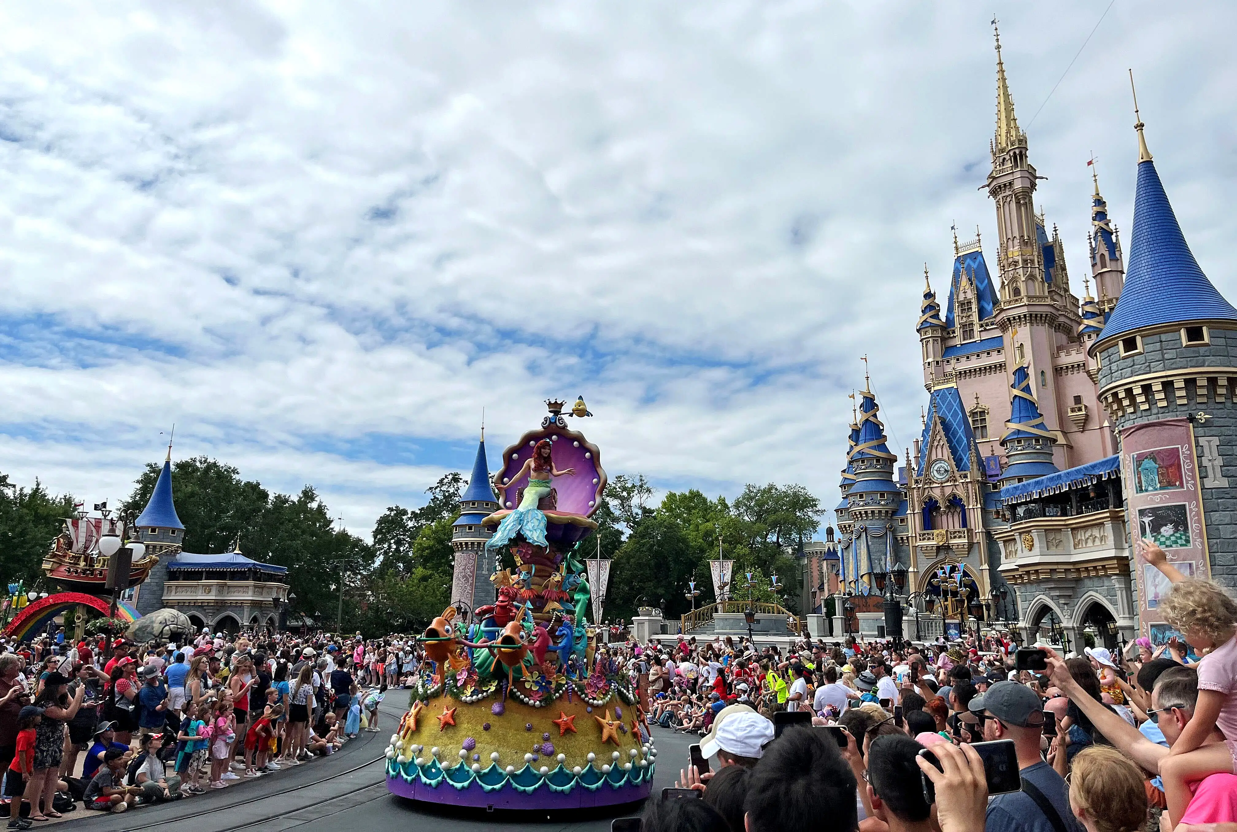 Parade surrounded by crowds at Disney World