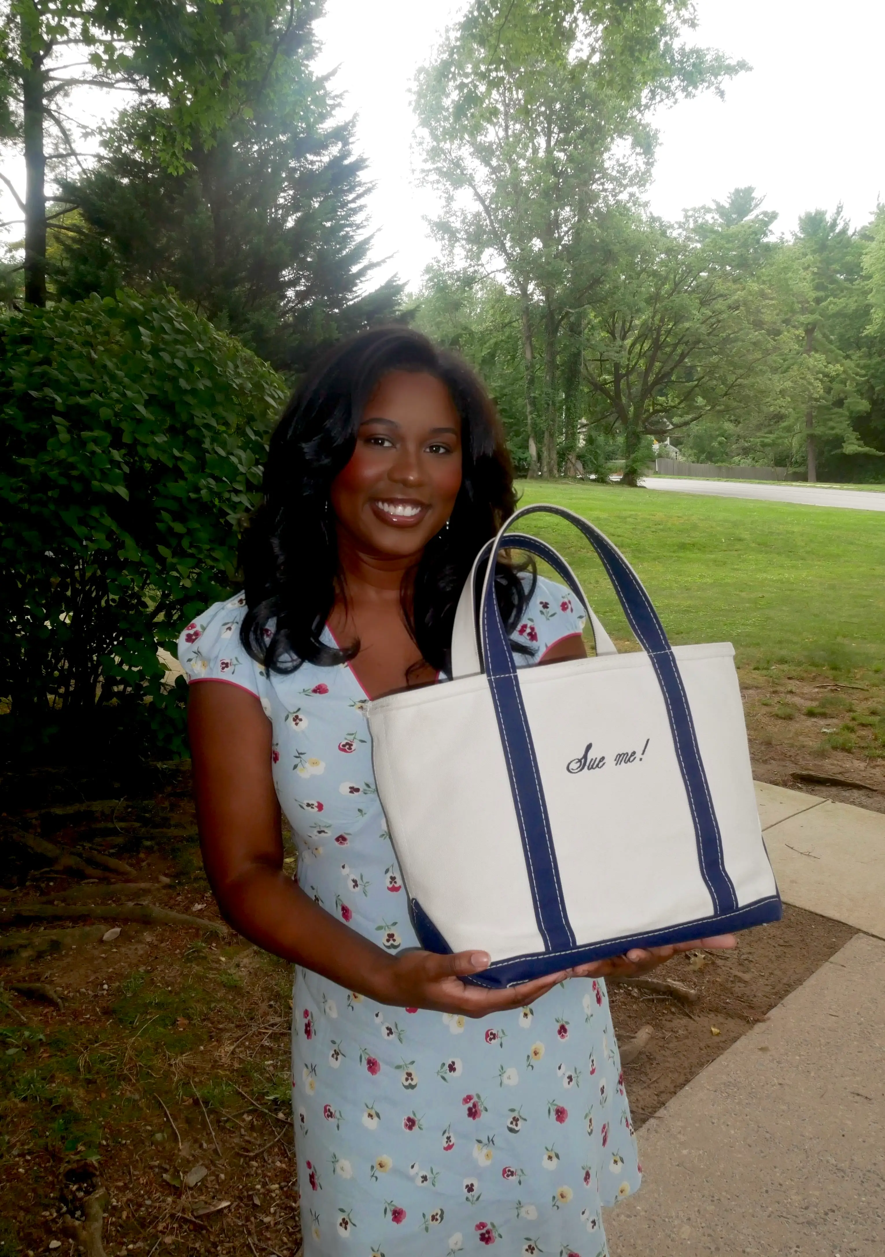 Morgan Blunt carries her L.L. Bean Boat and Tote bag that says 