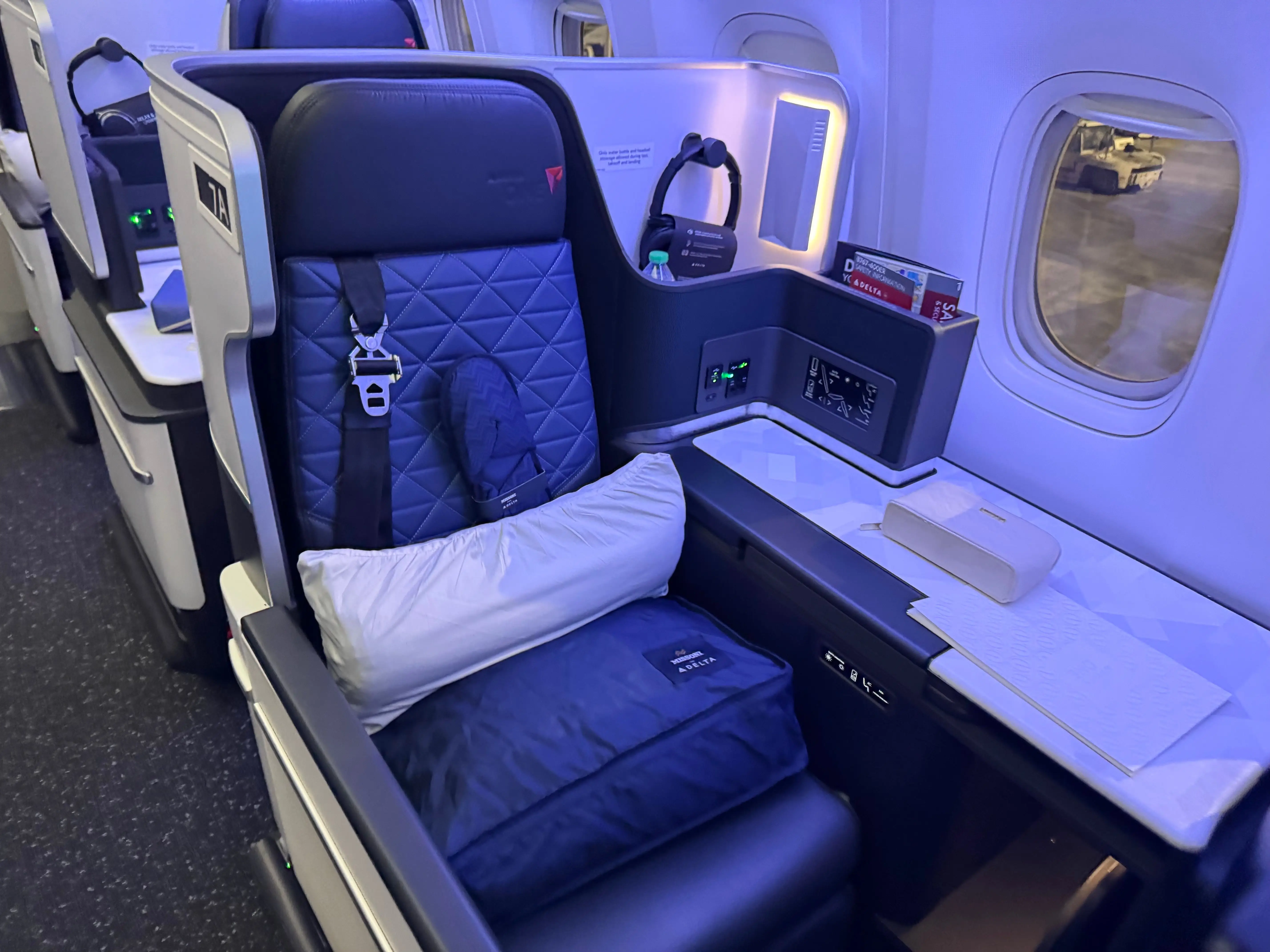 This is Delta One with the current branding on a Boeing 767-400ER, but it is a modified version with no door.