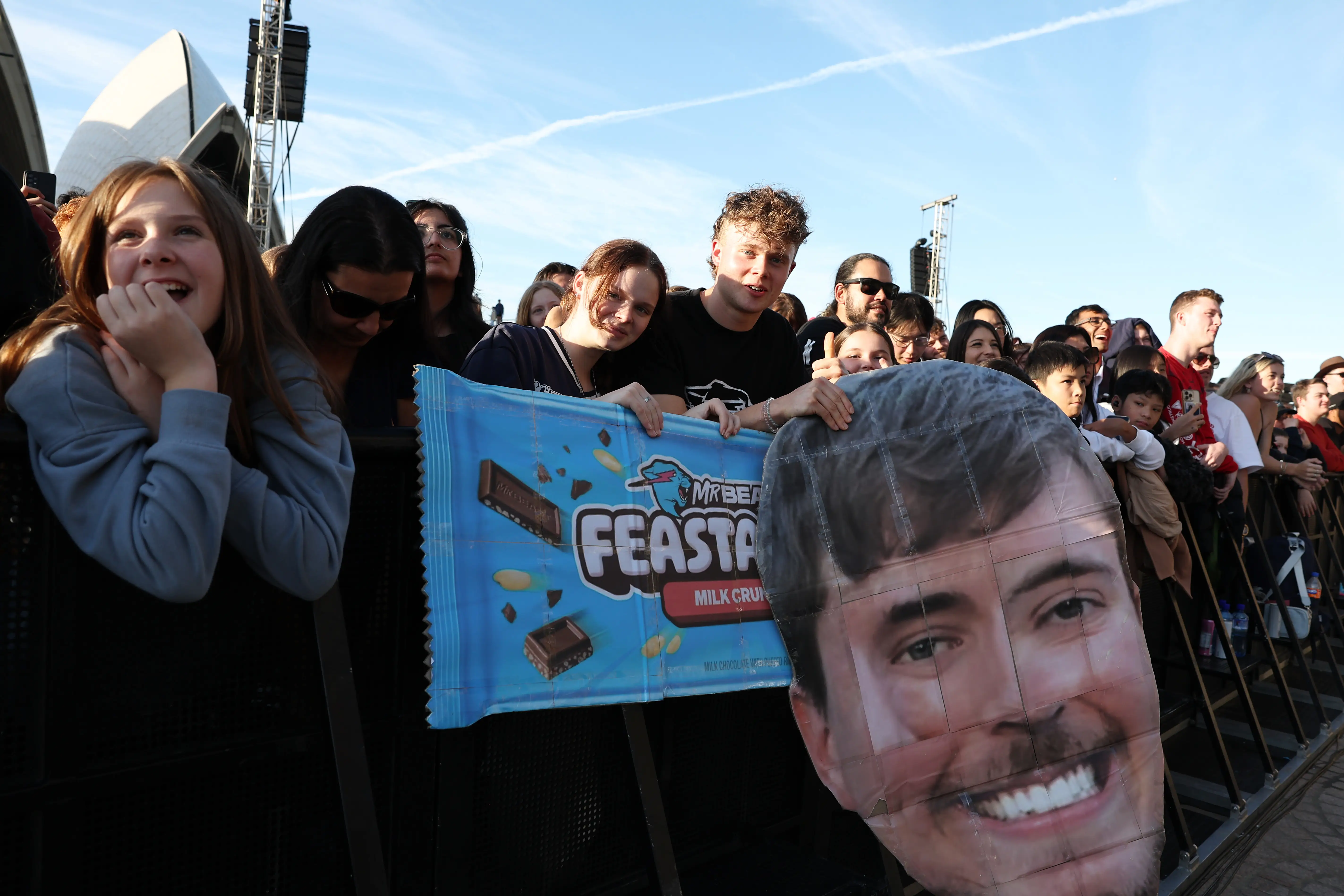 SYDNEY, AUSTRALIA - JUNE 26: Fans look on during the MrBeast Feastables launch at Sydney Opera House on June 26, 2024 in Sydney, Australia. (Photo by Don Arnold/WireImage)