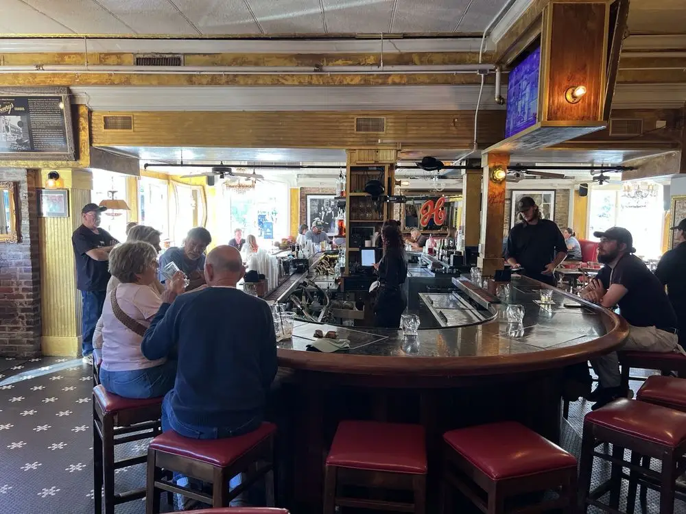 People at the bar at Henry's on the Market