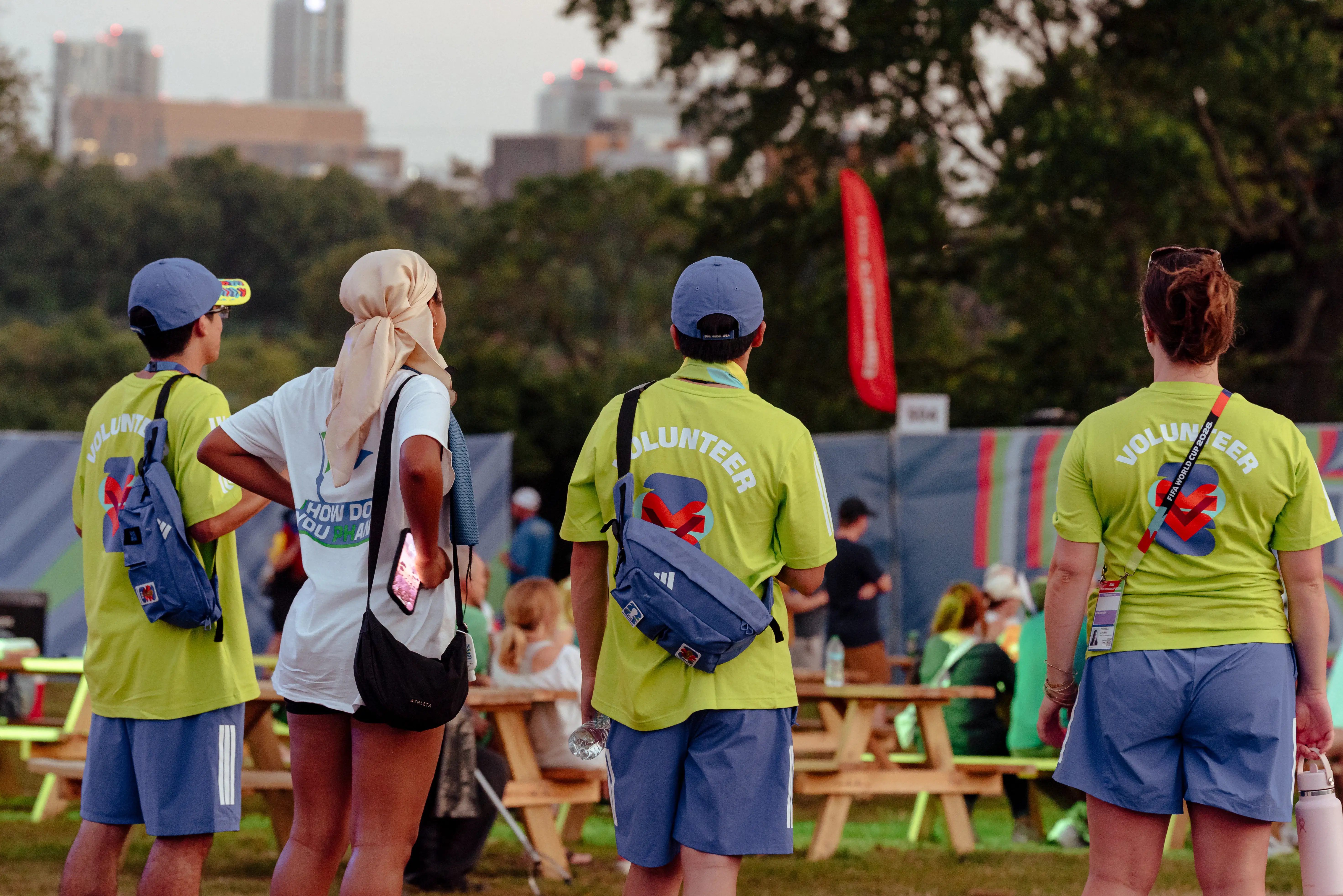 Volunteers at FIFA Fanfest wore blue and lime green kits.