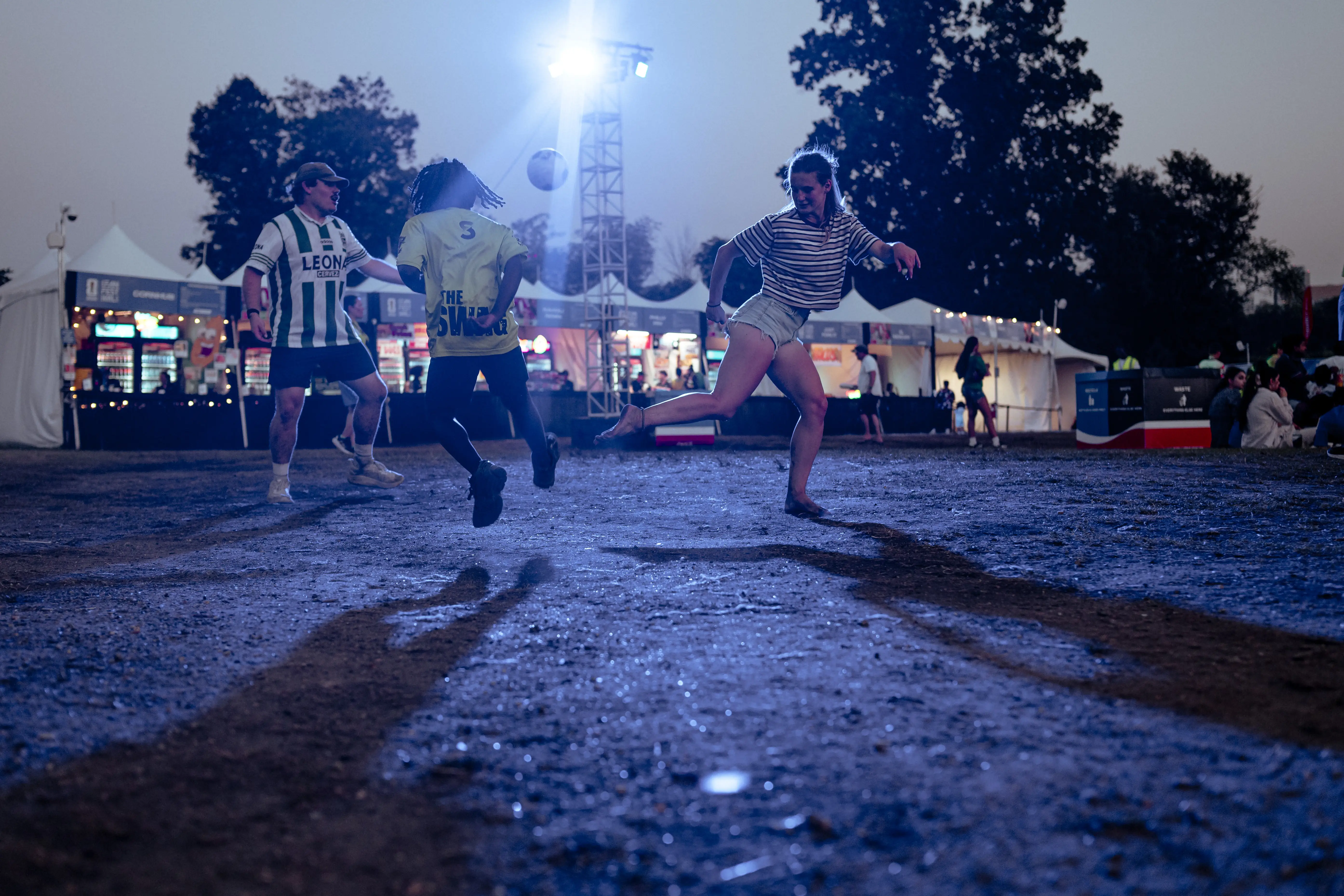 FanFest attendees practice their soccer skills together.