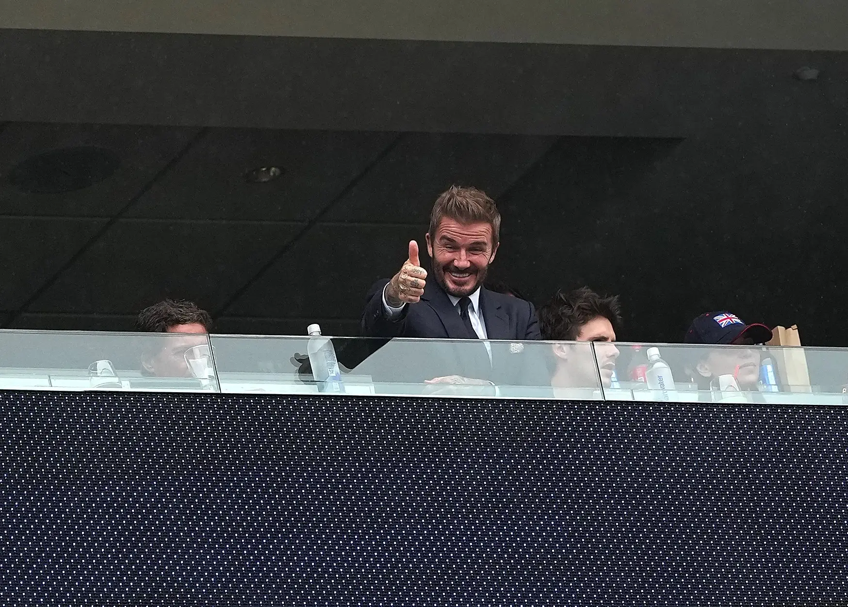 Former England footballer David Beckham 2nd L reacts before the group L match between England and Ghana at the 2026 FIFA World Cup at Boston Stadium in Boston, the United States, June 23, 2026.