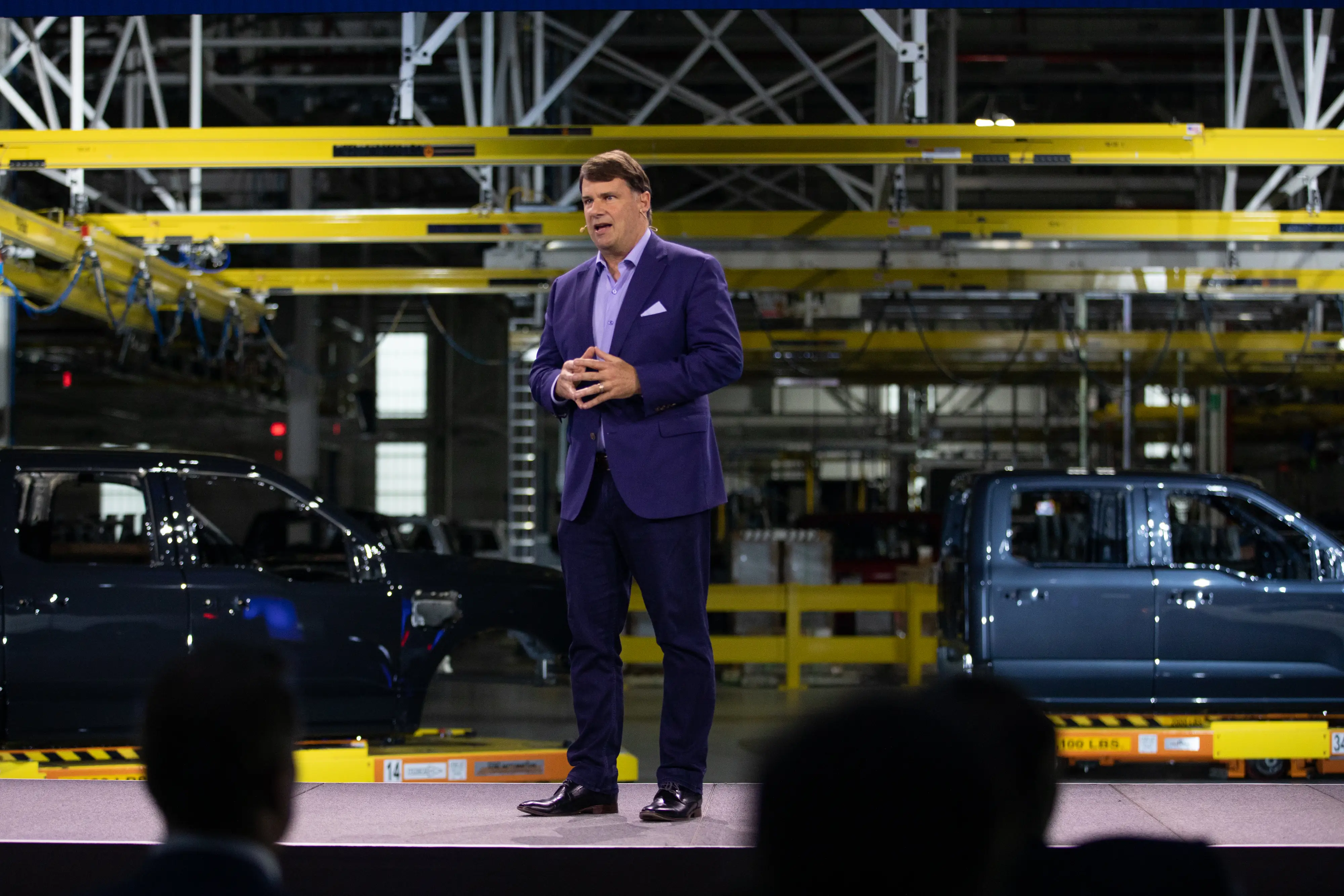 Ford CEO Jim Farley speaks onstage during a showcase of the automaker's EV plant.