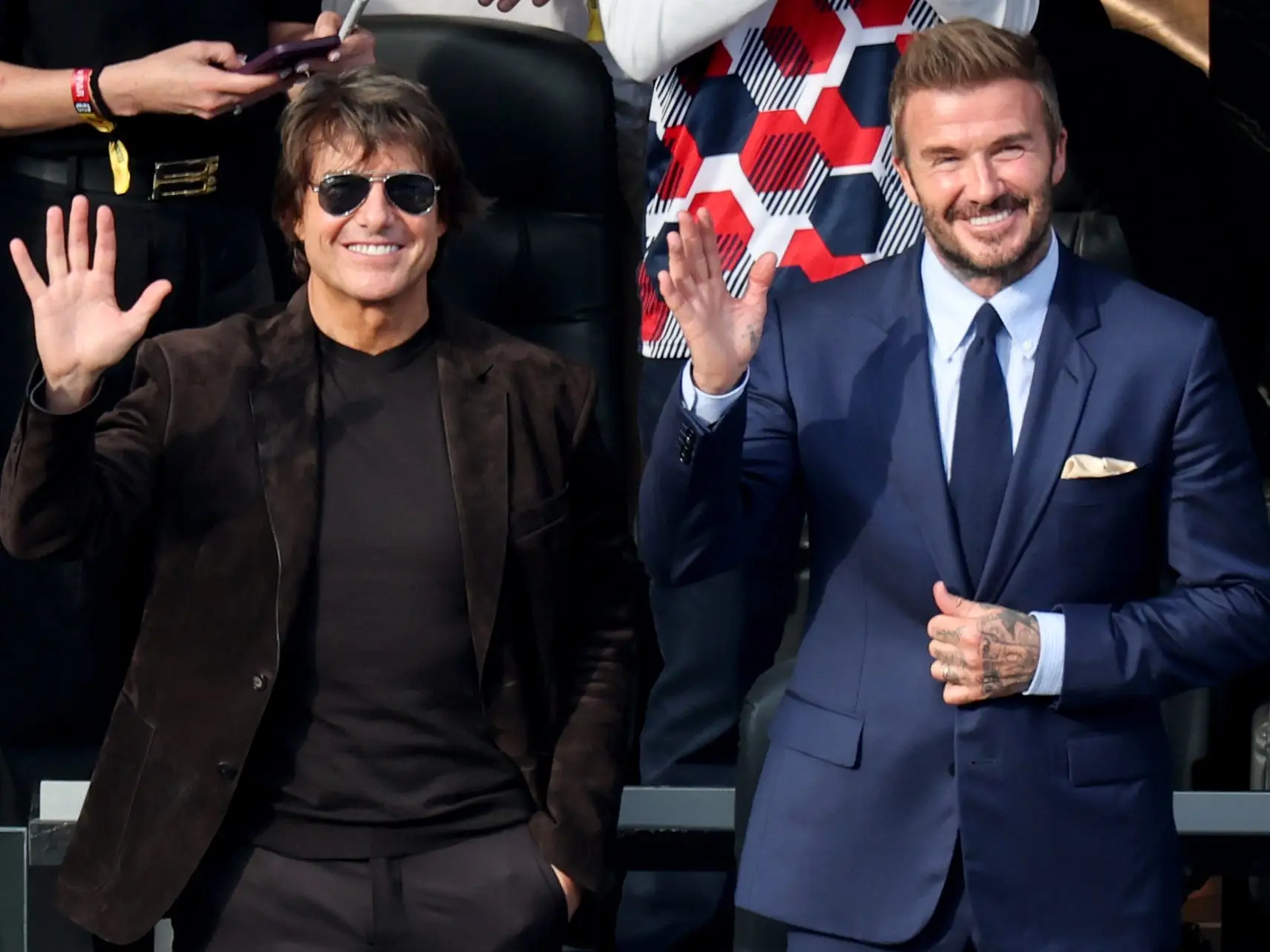 David Beckham, right, and Tom Cruise waves to fans before the World Cup group stage match between United States and Paraguay at the SoFi Stadium on Friday, June 12, 2026 in Inglewood, CA.