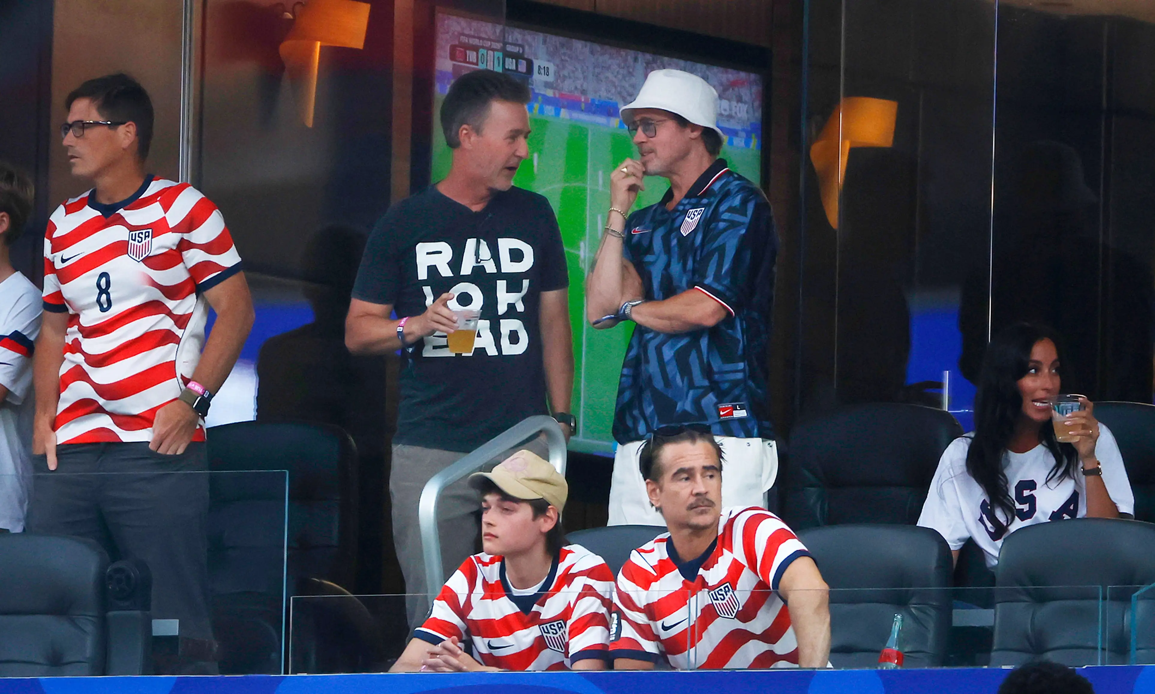 Ed Norton, Brad Pitt, center, and Colin Farrell, sitting, watch the United States play Turkiye during a FIFA World Cup 2026 match at Los Angeles Stadium on June 25, 2026 in Inglewood, California.
