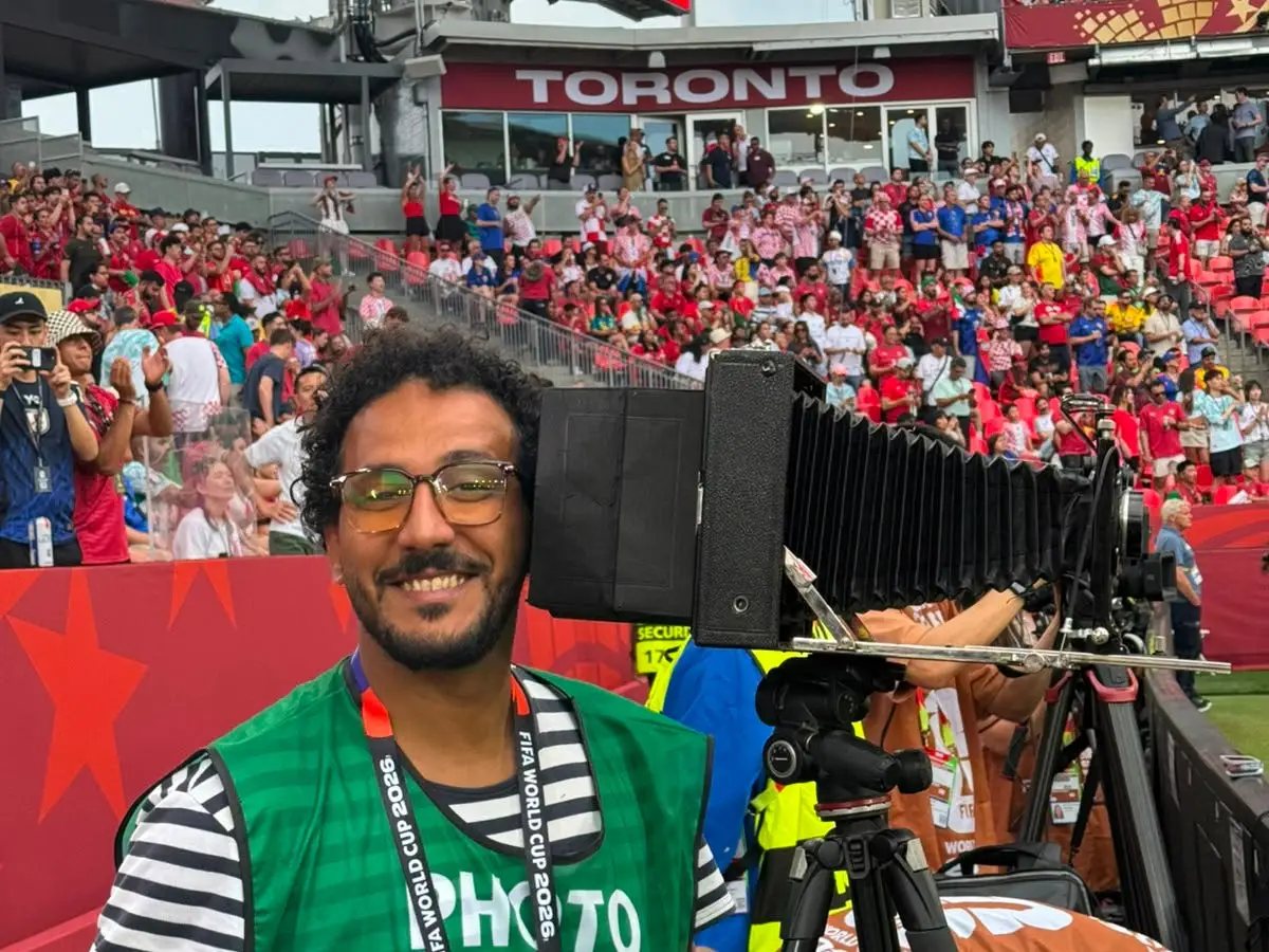 Fareed Kotb taking photos at the World Cup