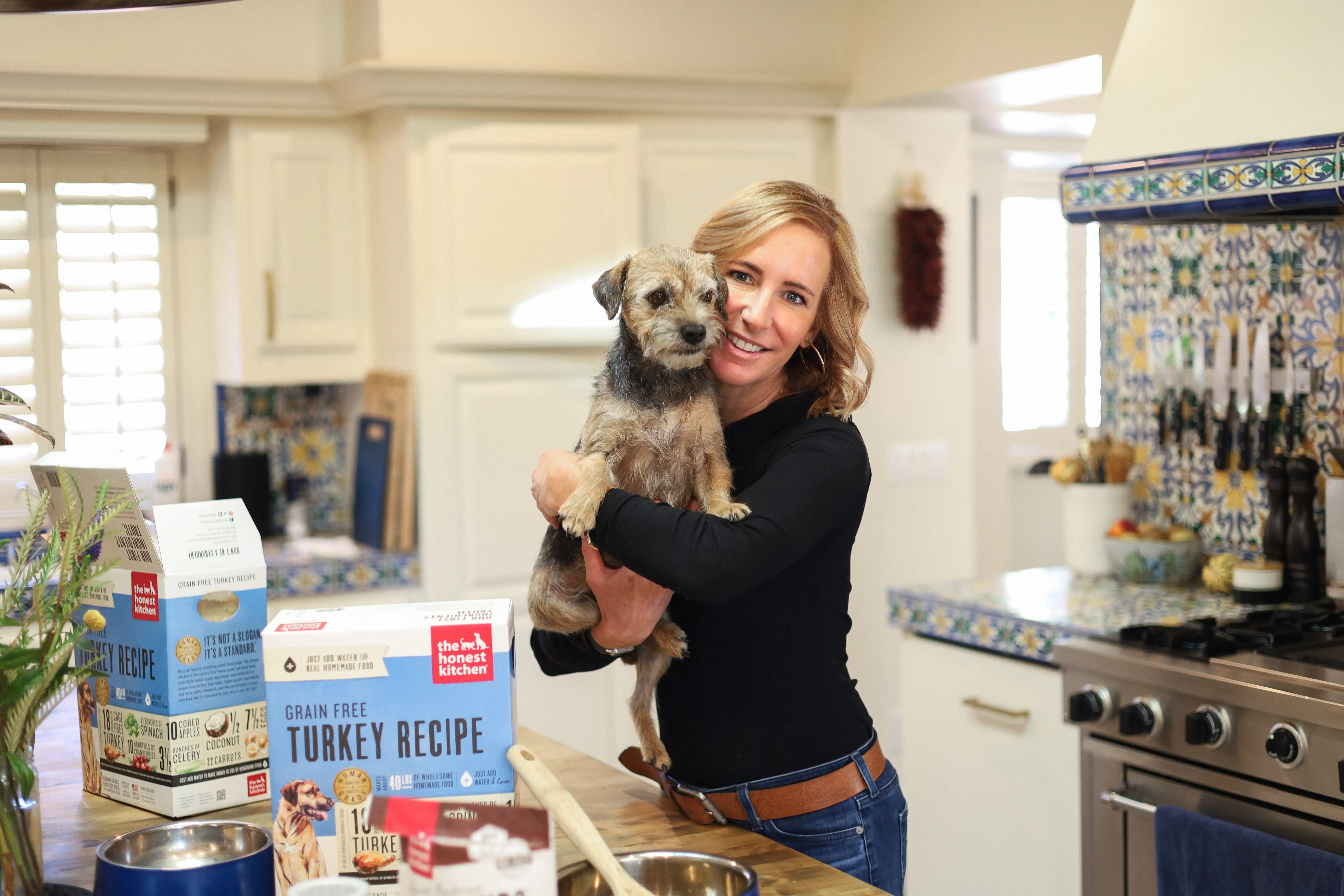 Lucy Postins holding dog