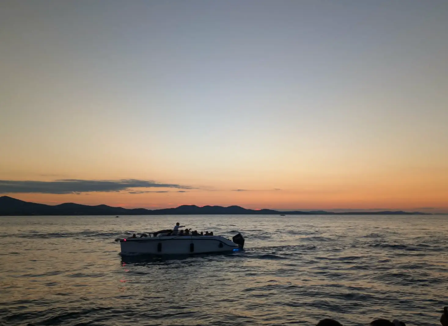 A boat in the water at sunset in Zadar, Croatia.