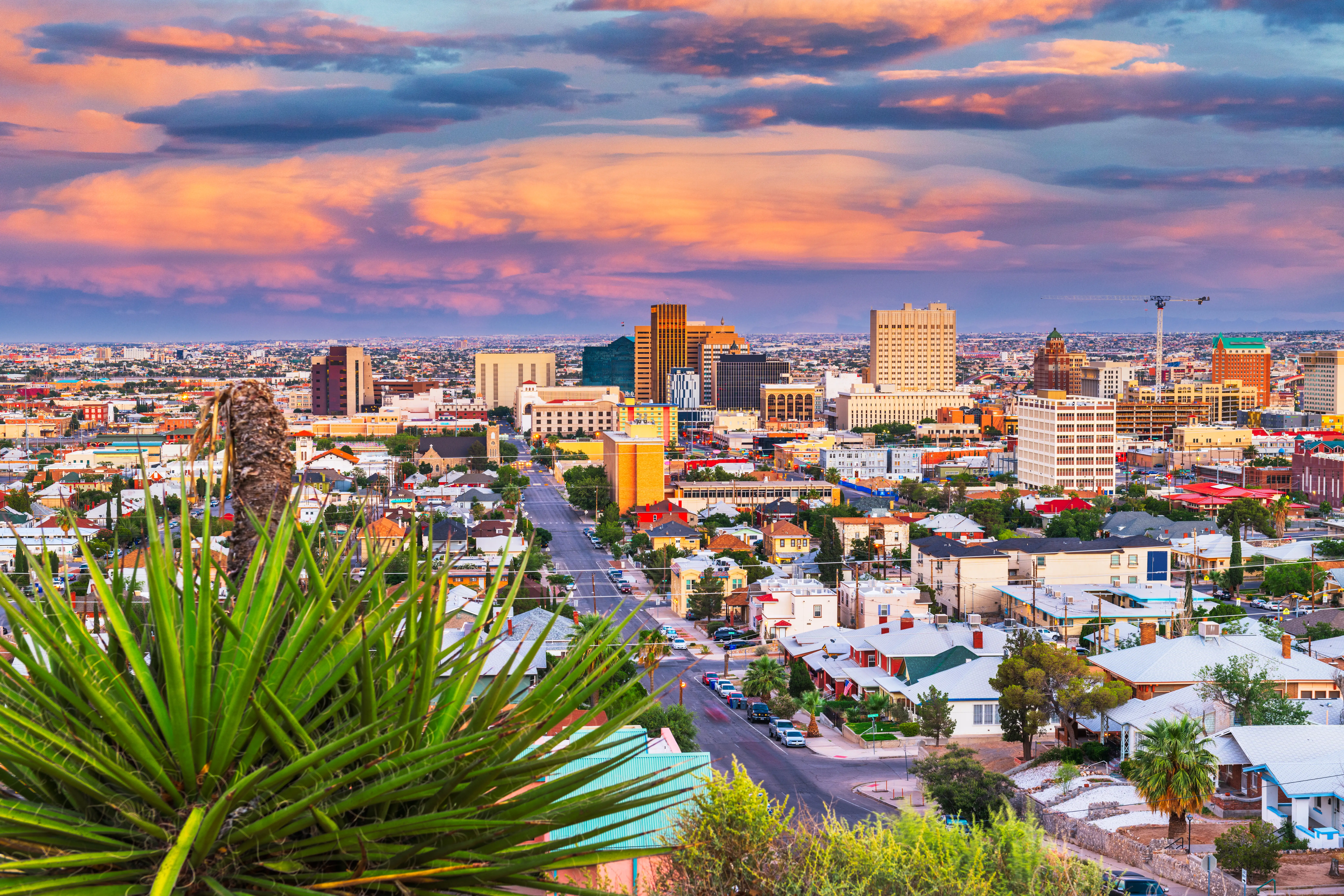 El Paso, Texas, downtown city skyline at dusk with Juarez, Mexico in the distance.