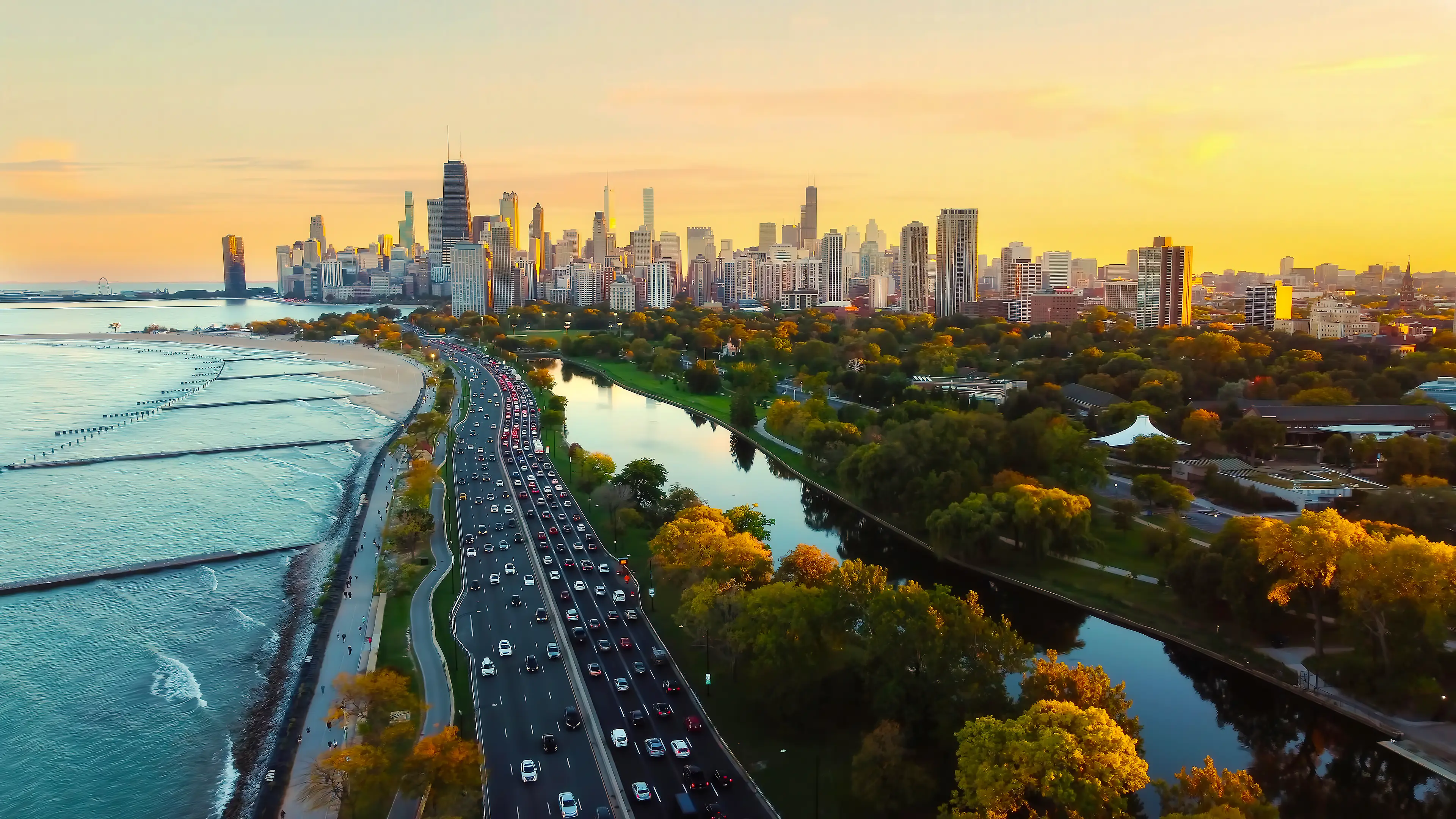 Chicago cityscape at sunset with lakefront view.