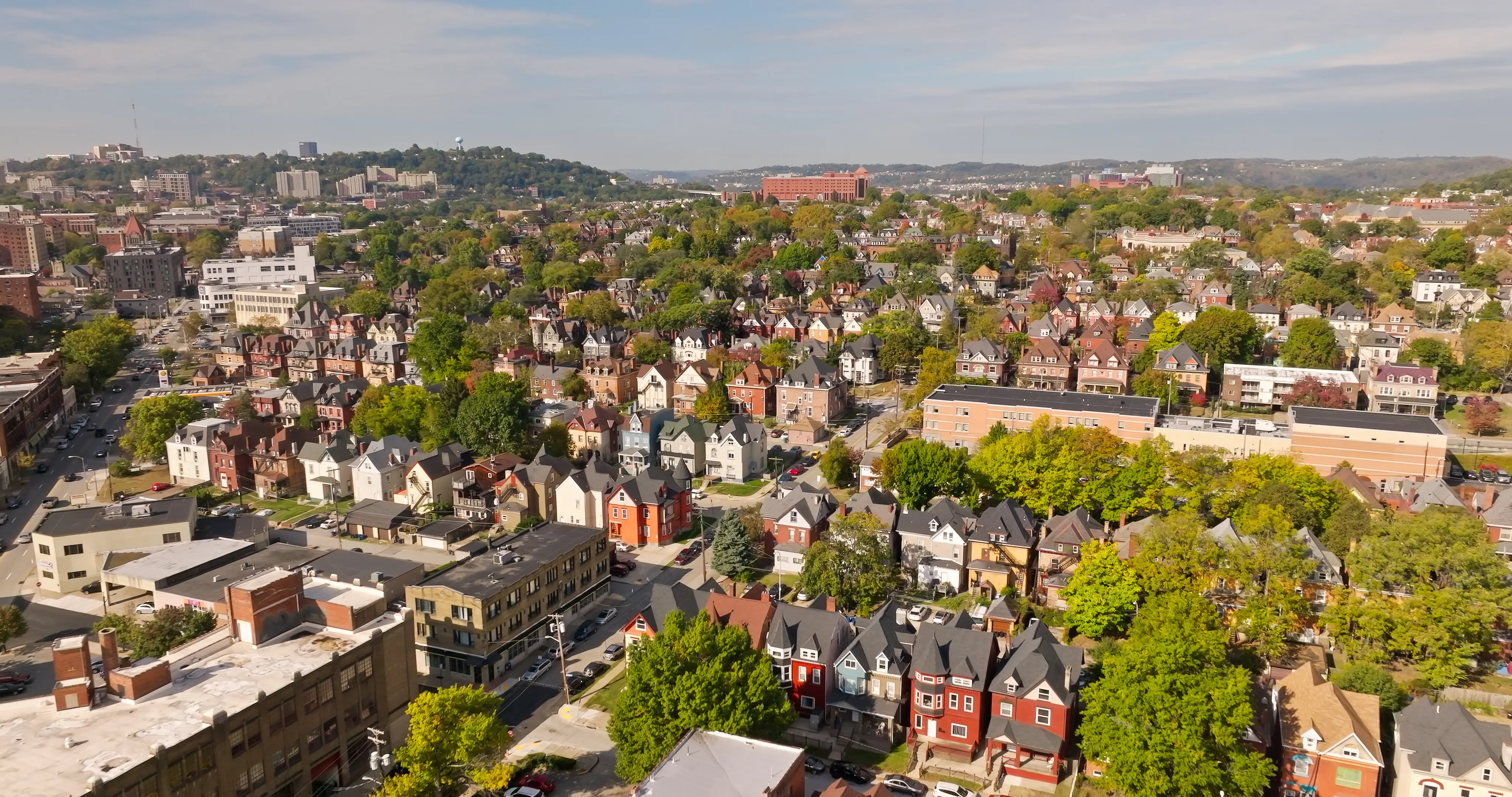 Aerial shot of Friendship, a neighborhood in the East End of Pittsburgh, Pennsylvania, on a sunny morning in Fall.