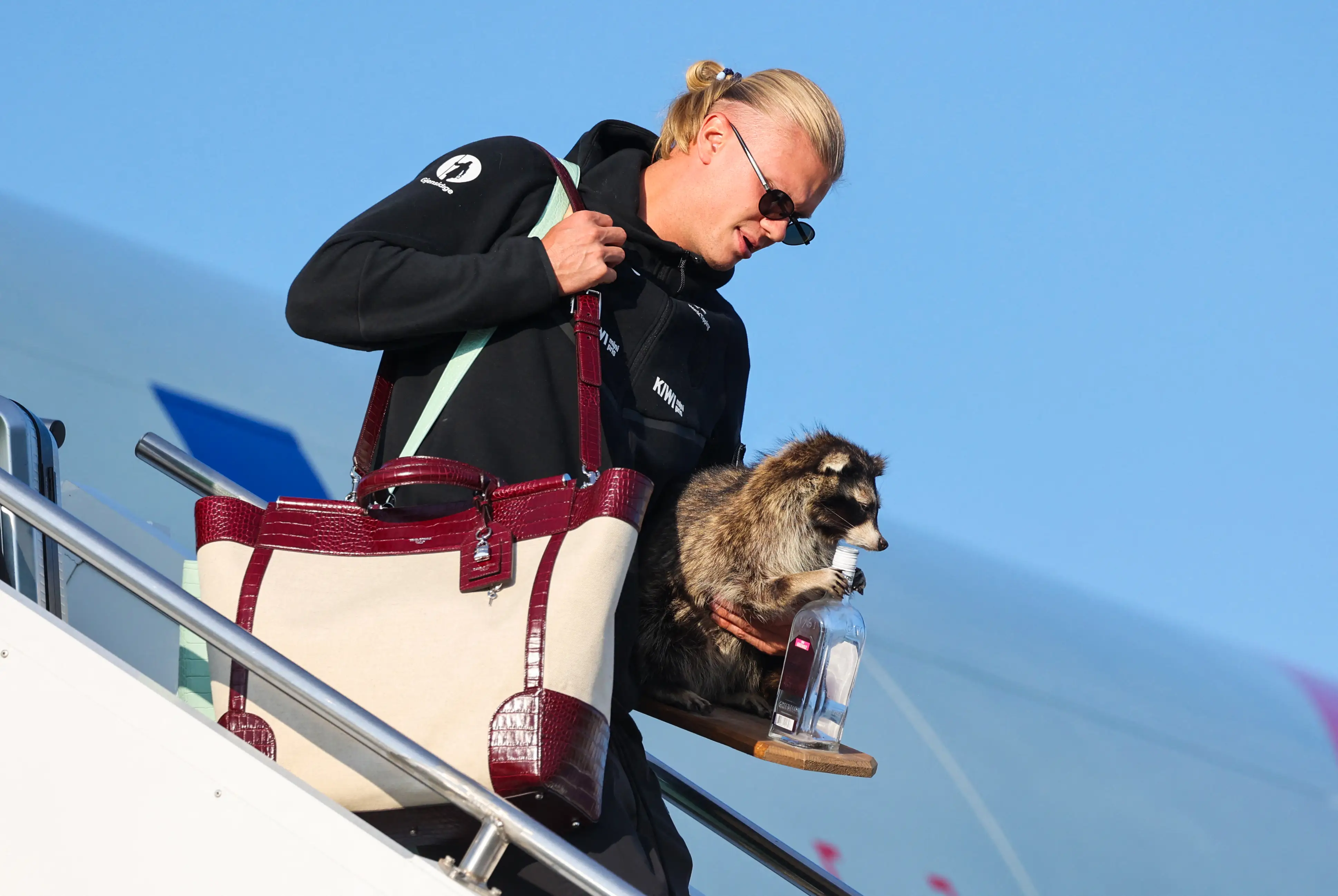 Norway's striker Erling Braut Haaland gets off the plane after Norway's national football team landed at Oslo's Gardermoen Airport on July 13, 2026. Norway were knocked out in the quarter-final match against England.