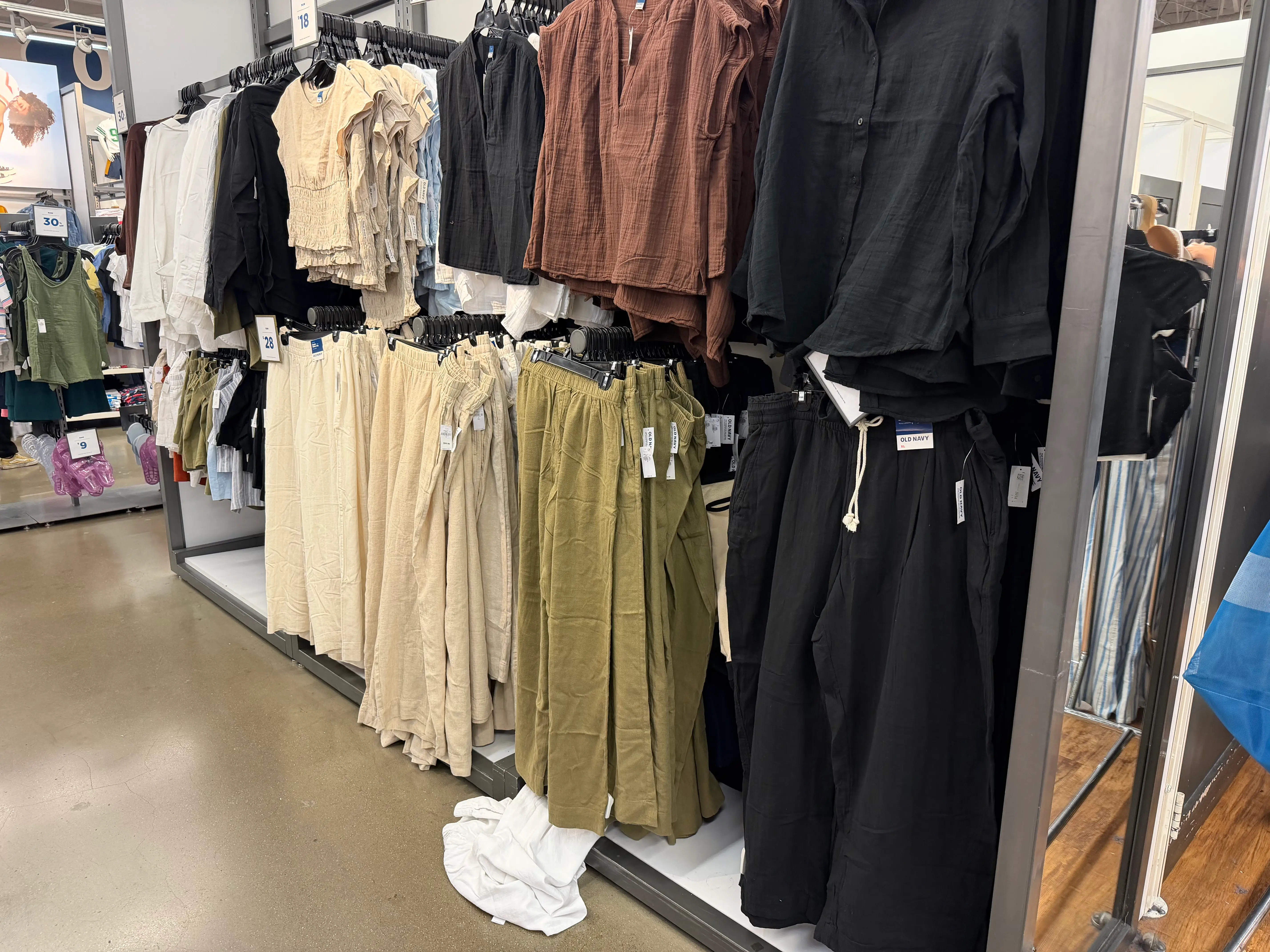 Linen-blend clothing hanging on racks at Old Navy.