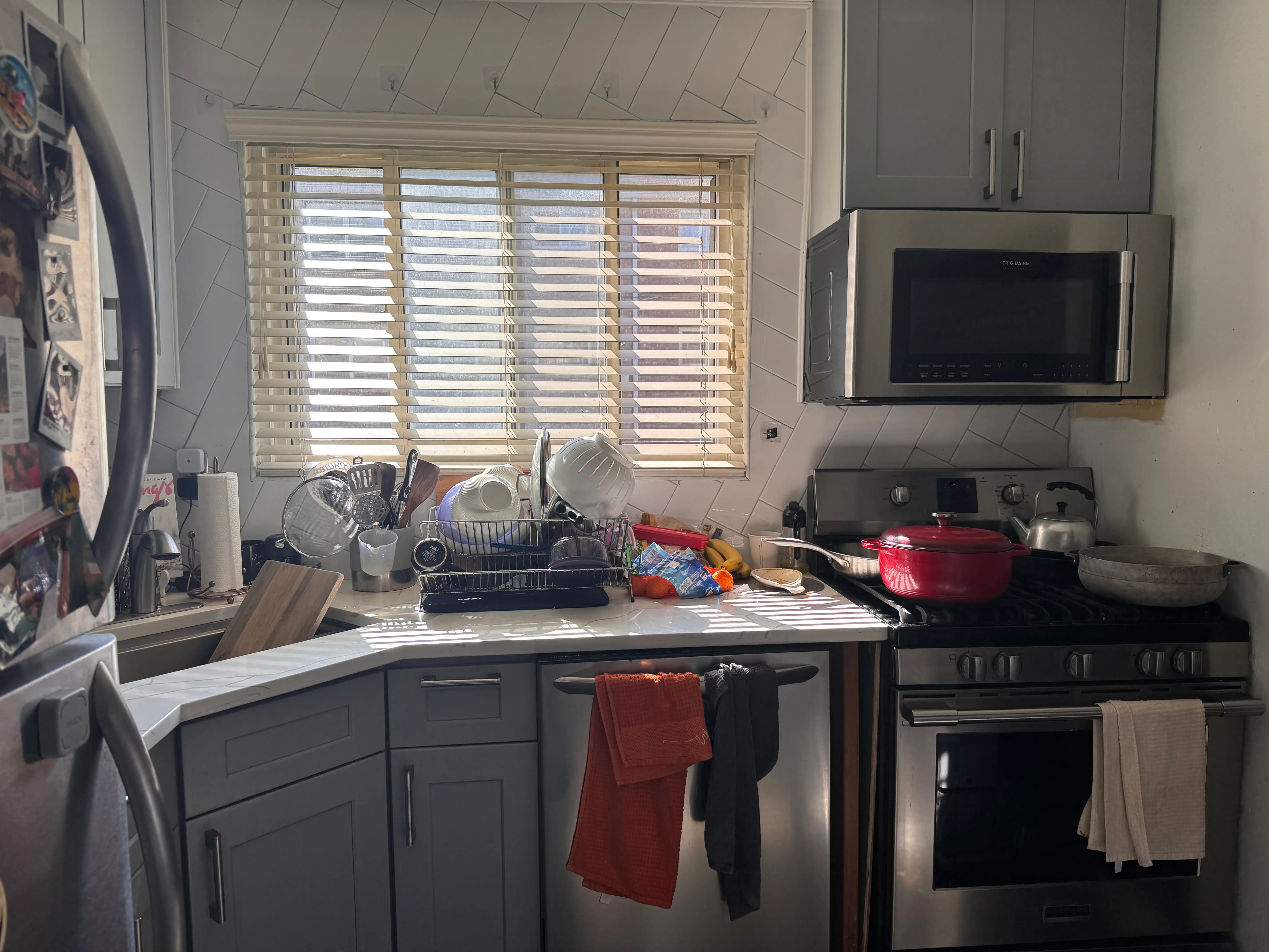 Kitchen with white counters, blue cabinets