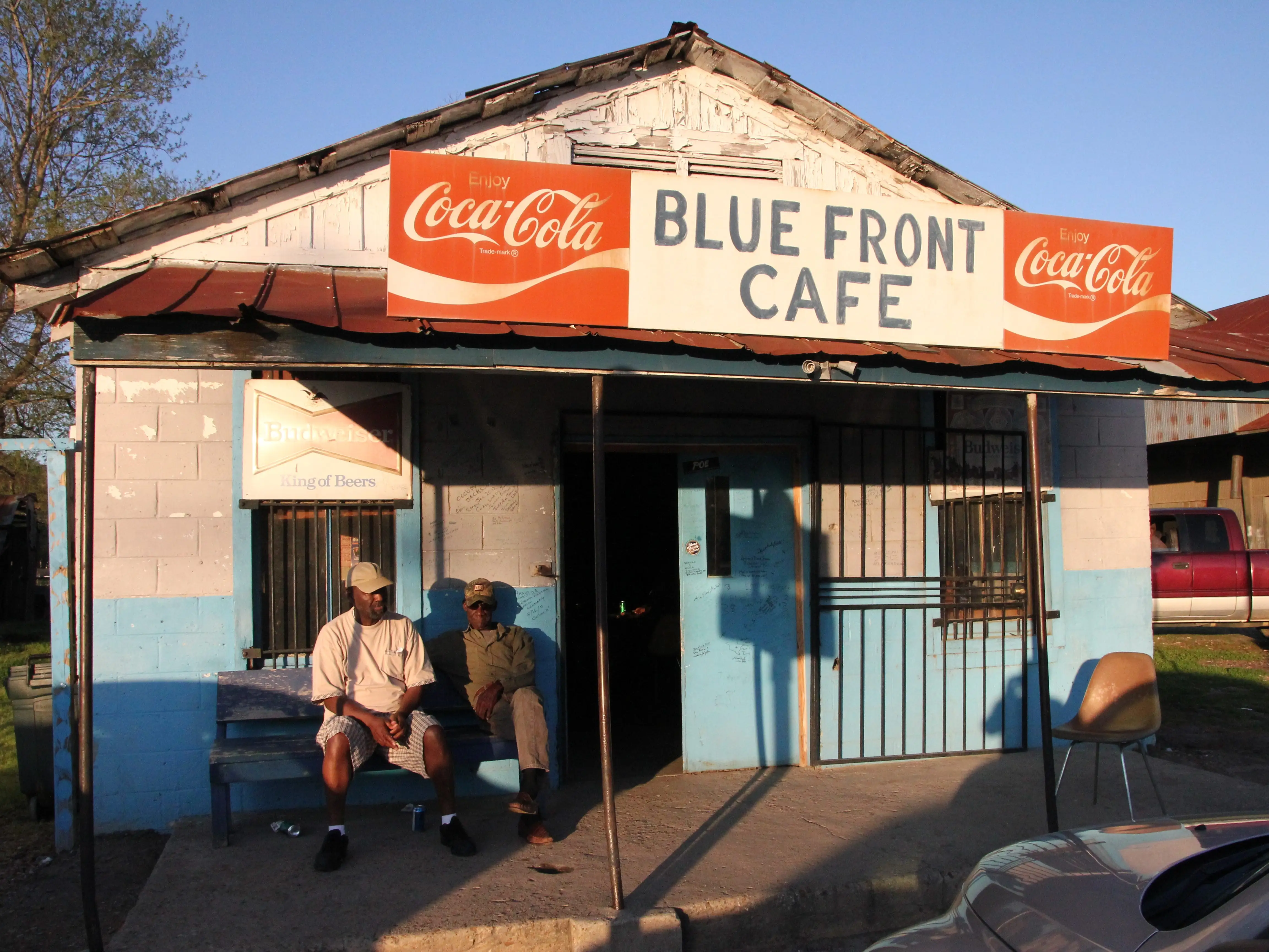 Jimmy Holmes sitting outside the Blue Front Cafe