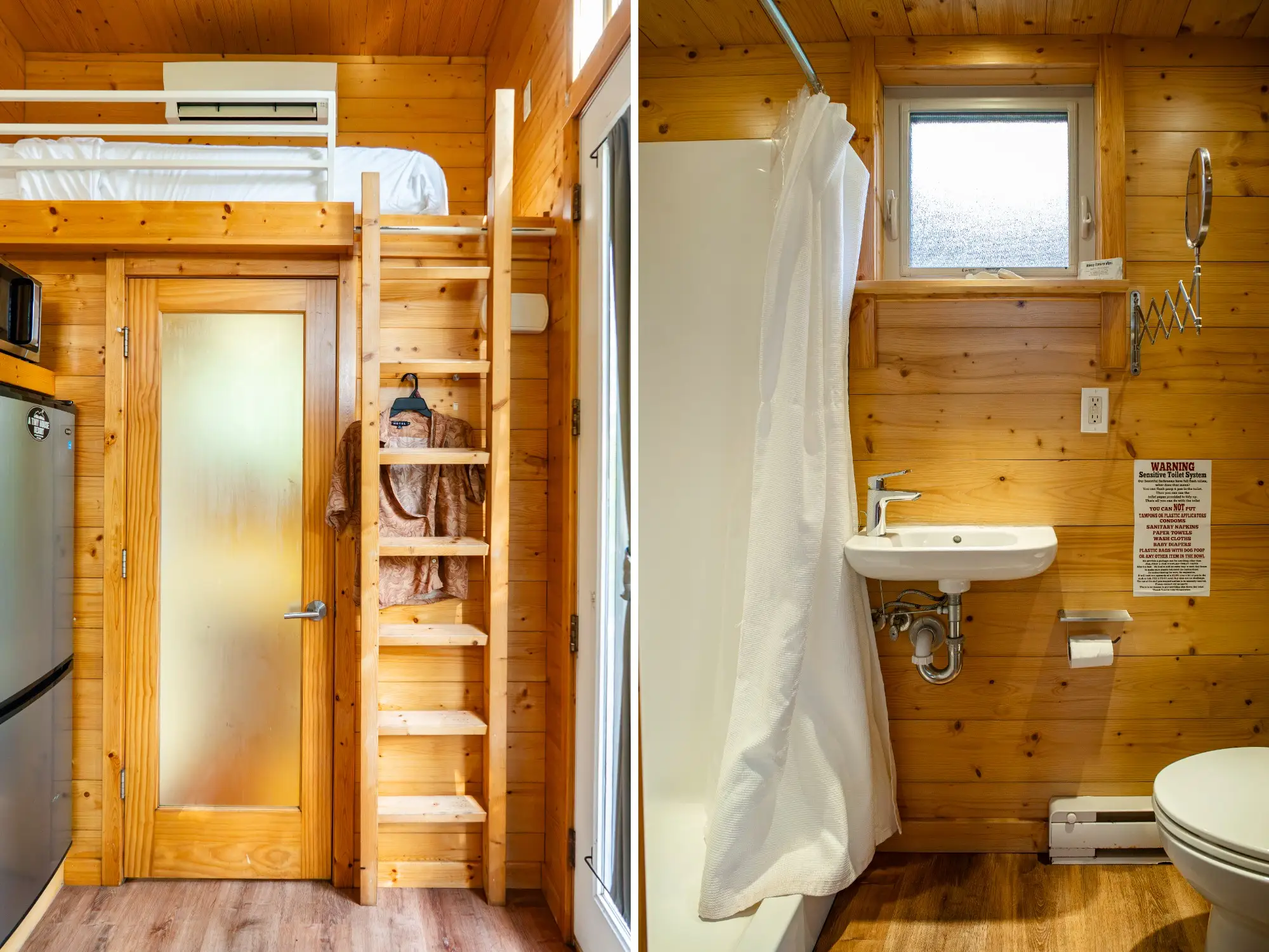 Wood-paneled tiny home interior shows a loft bed with ladder beside a compact bathroom with shower, sink, and toilet.