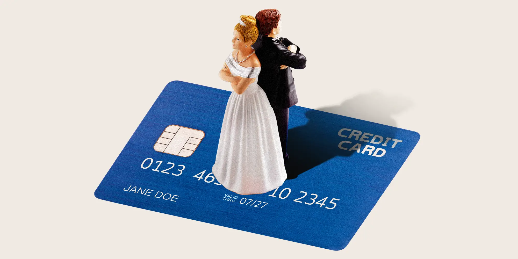 Wedding cake topper on a credit card