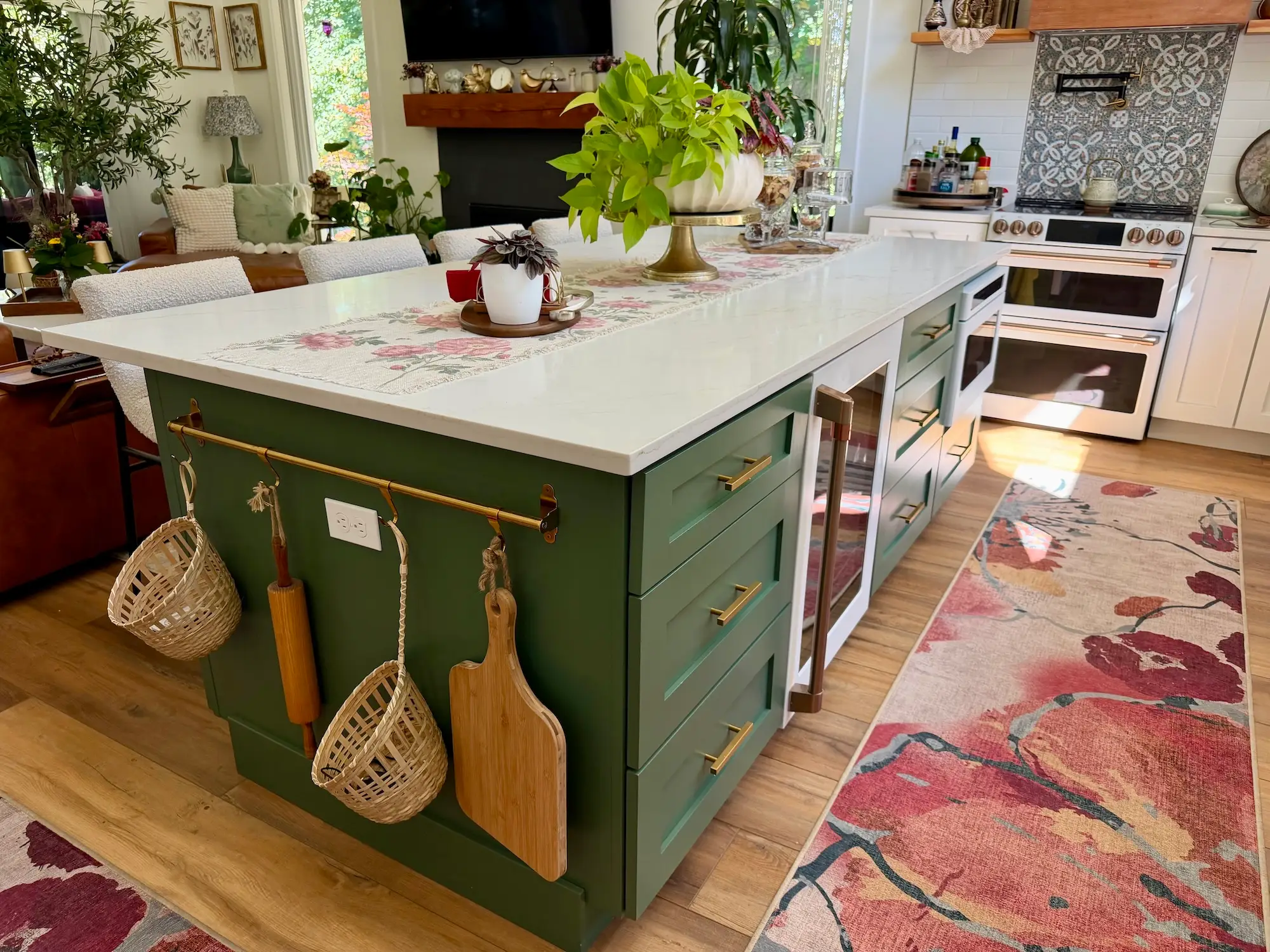 A green island in a large kitchen.