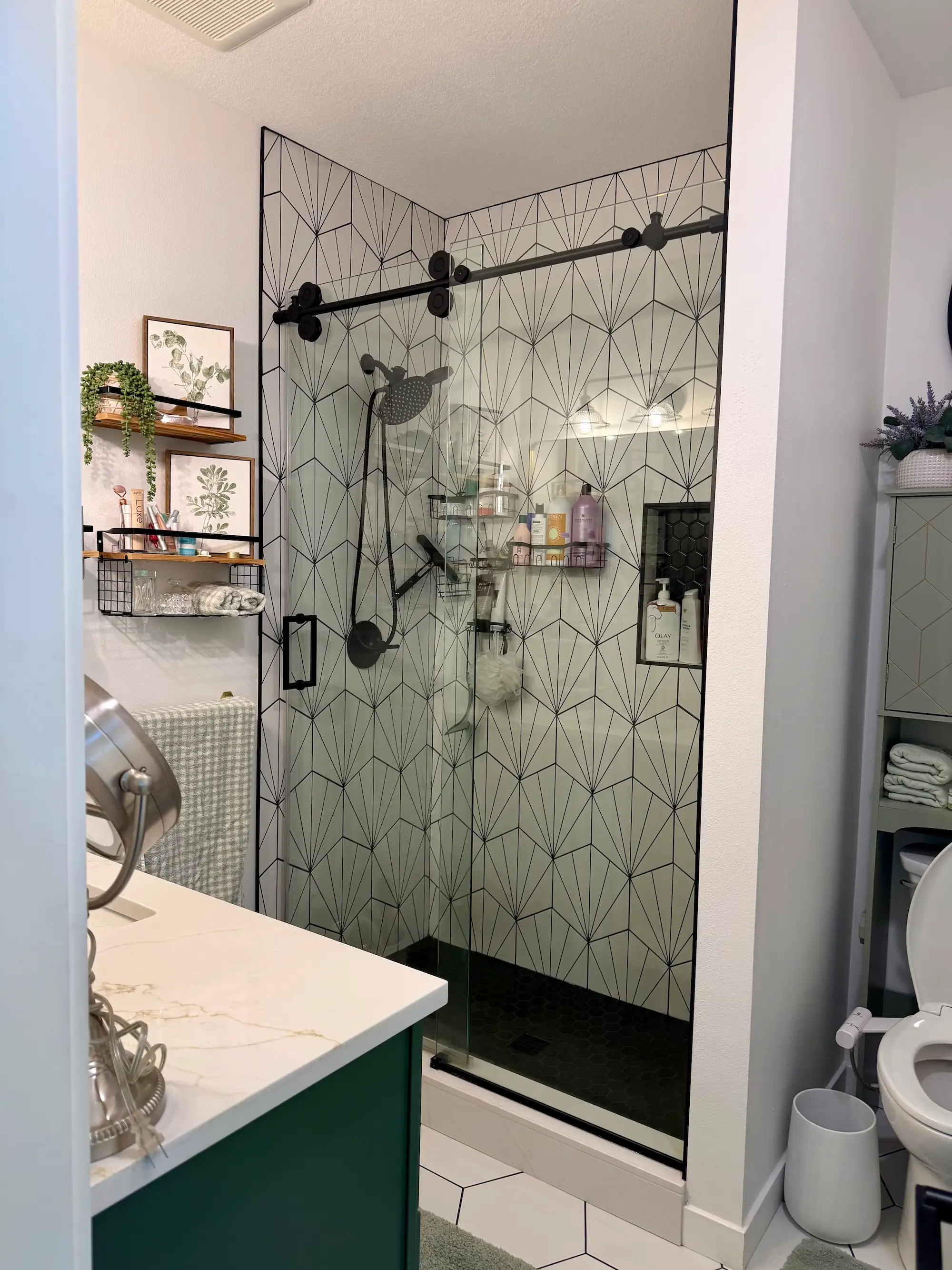 A bathroom with a shower with a glass cover.