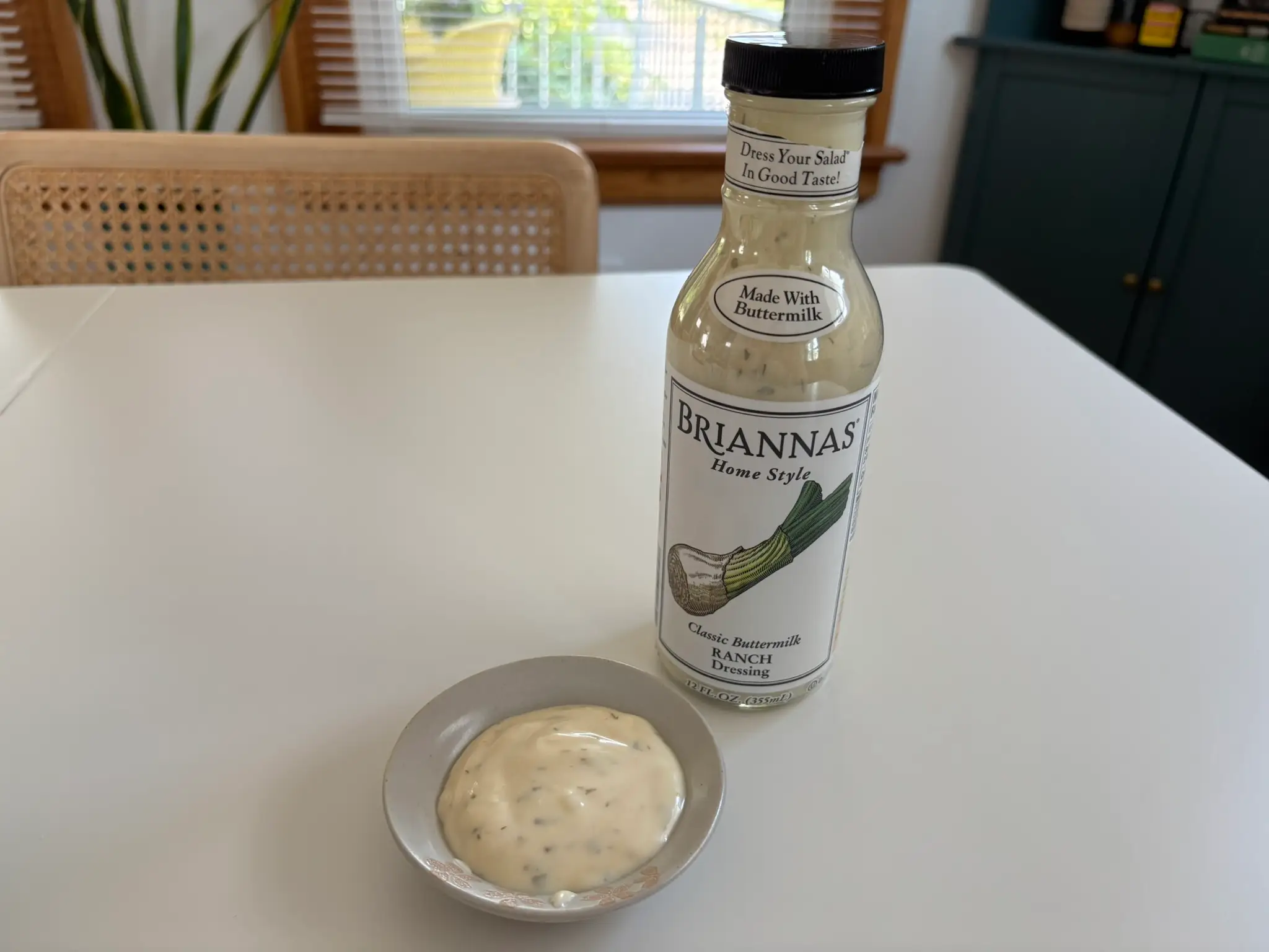 Brianna's ranch dressing bottle with small bowl of ranch next to it