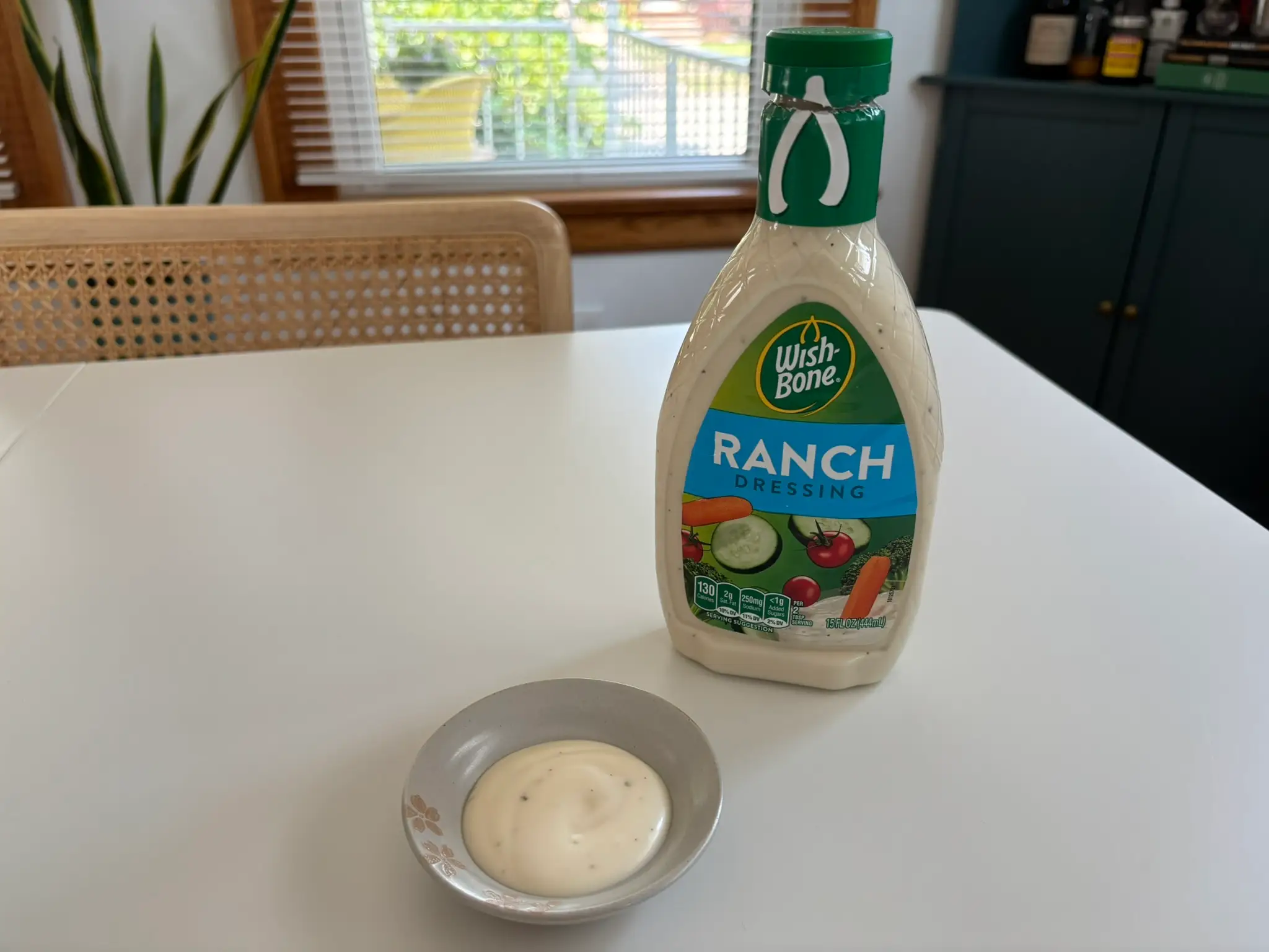 Wish Bone ranch dressing bottle with small bowl of ranch next to it